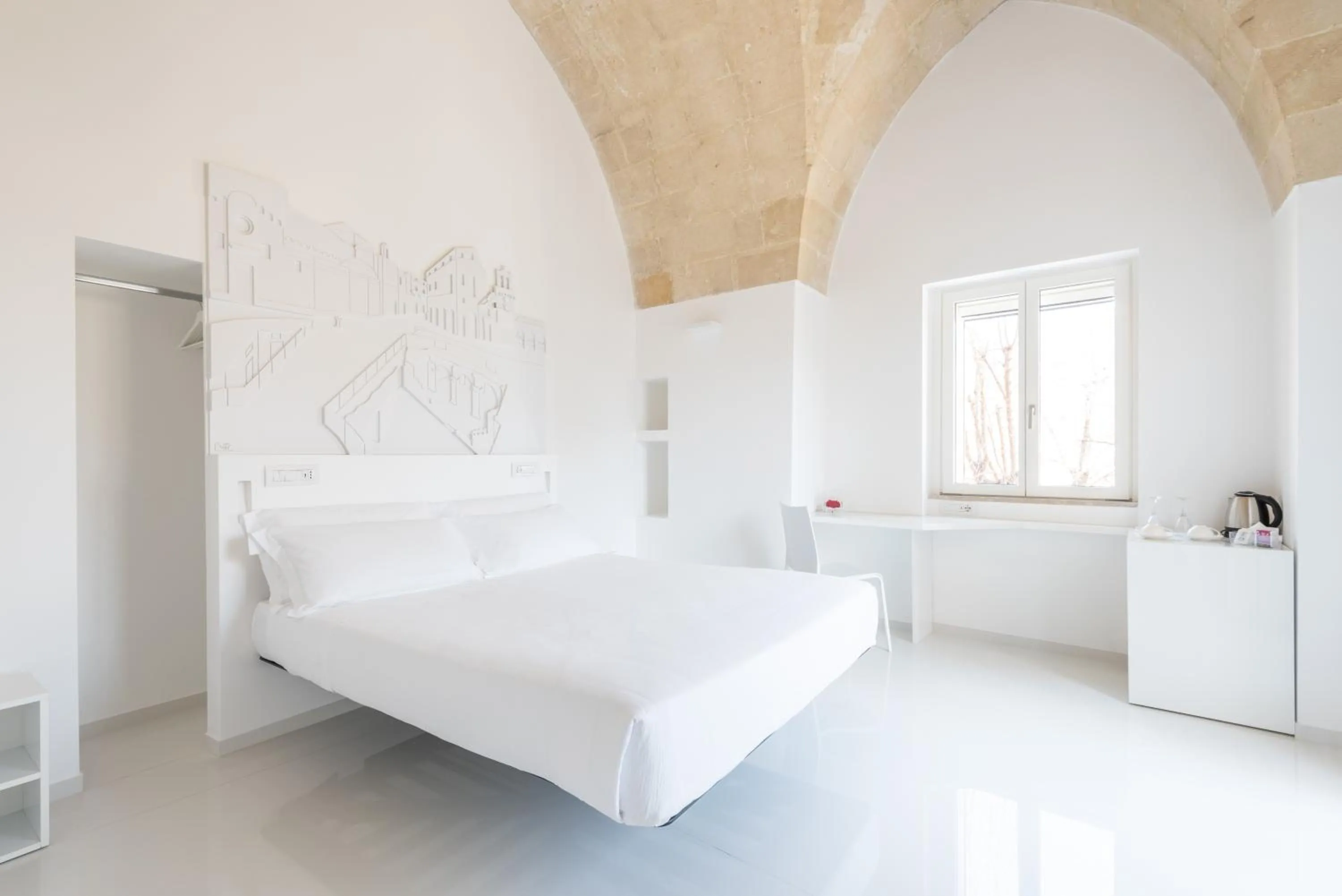 Bed in Vittorio Veneto Matera Luxury Rooms