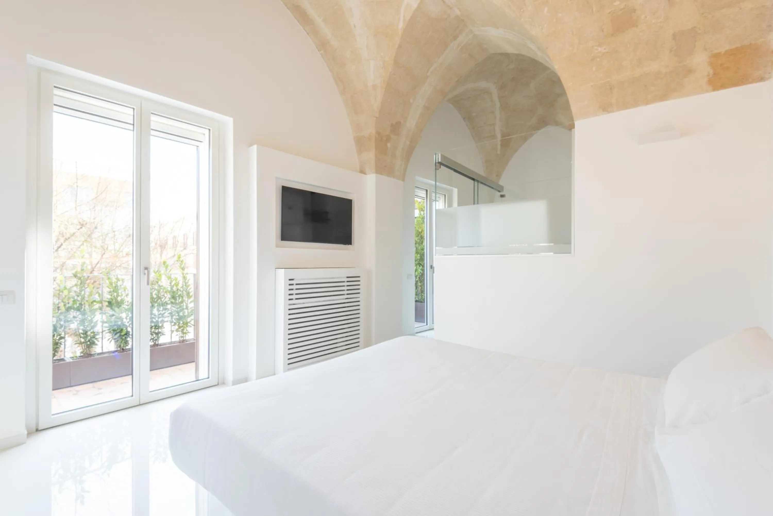 Bed in Vittorio Veneto Matera Luxury Rooms