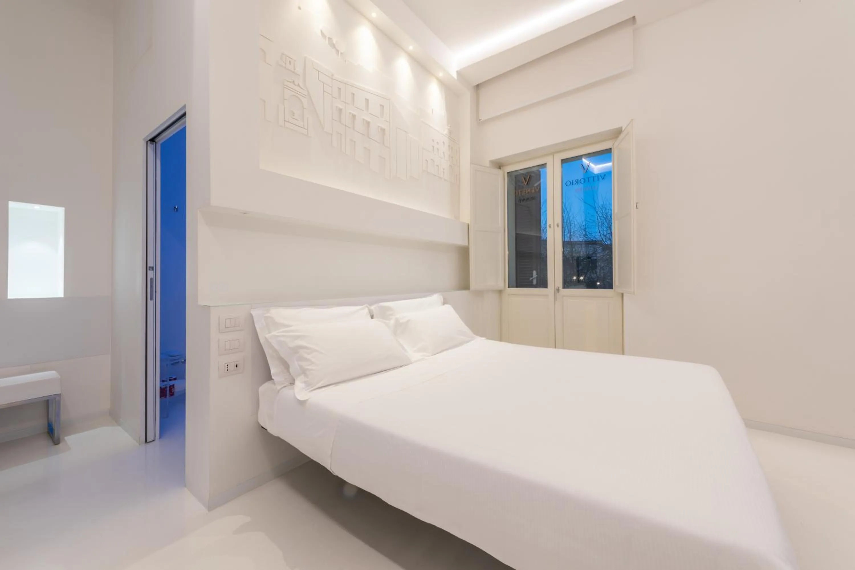 Bed in Vittorio Veneto Matera Luxury Rooms