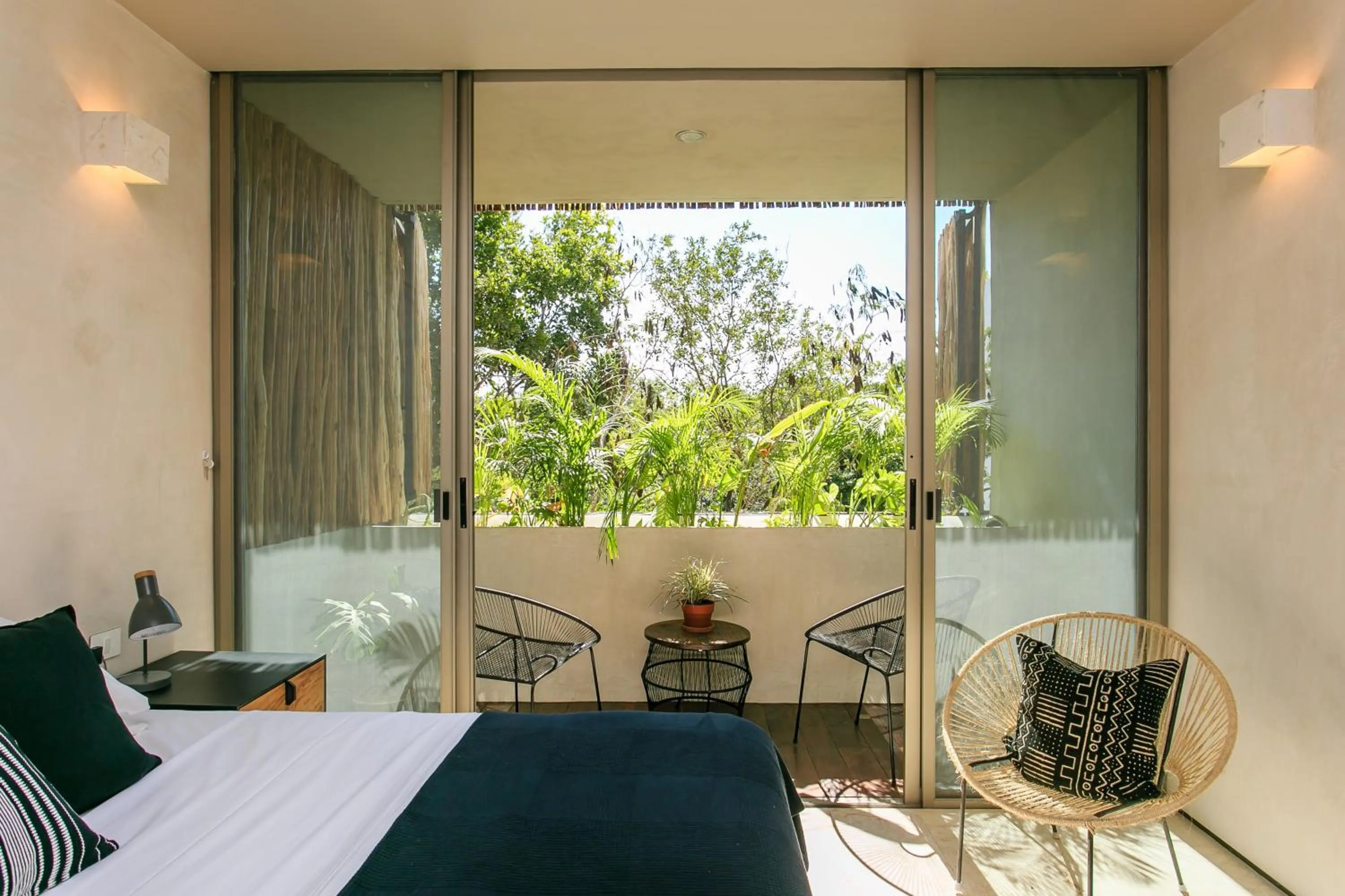 Balcony/Terrace, Bed in Eco-chic Design Condos Wrapped in Nature's Elements by Stella Rentals