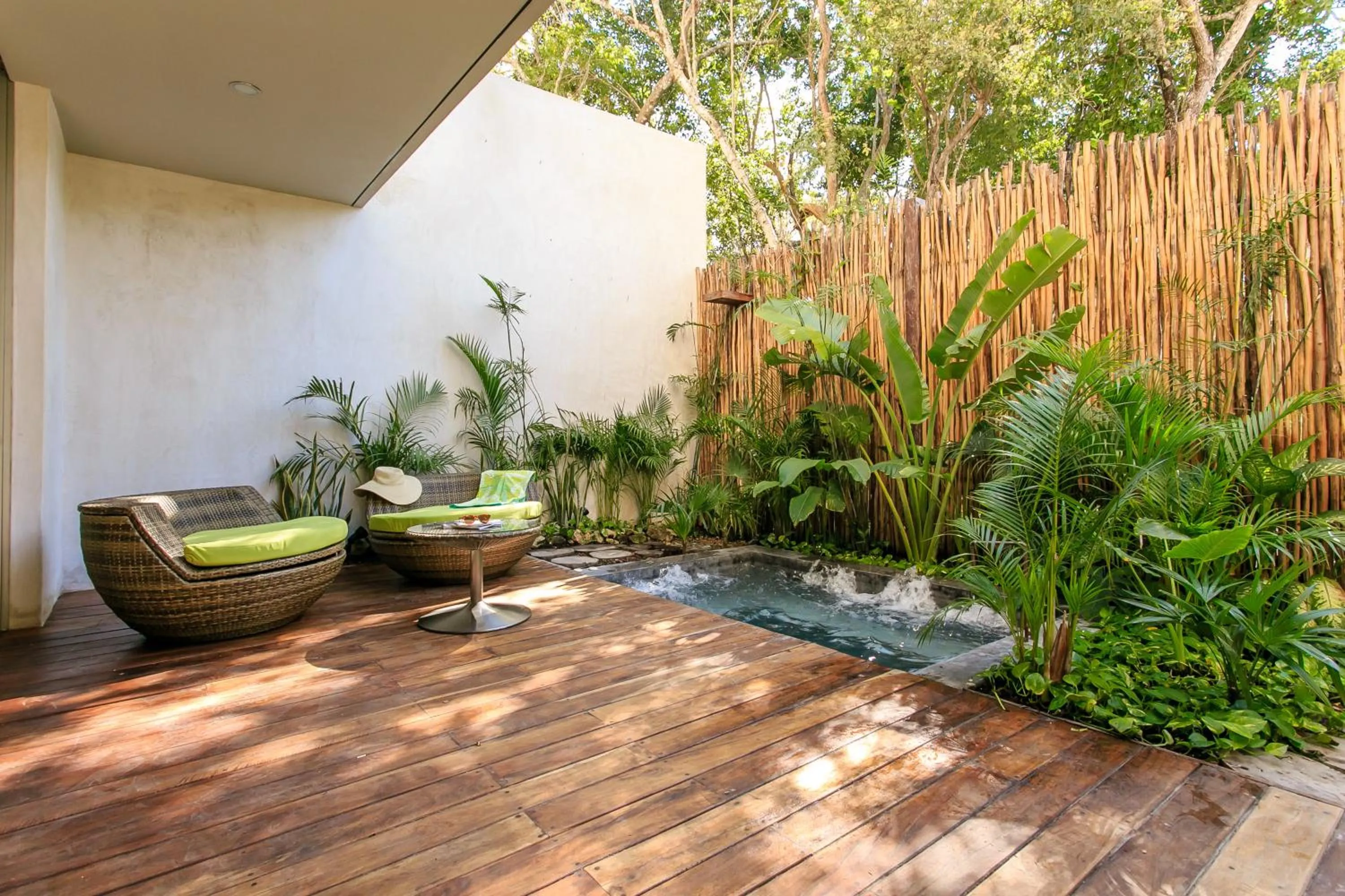 Balcony/Terrace in Eco-chic Design Condos Wrapped in Nature's Elements by Stella Rentals