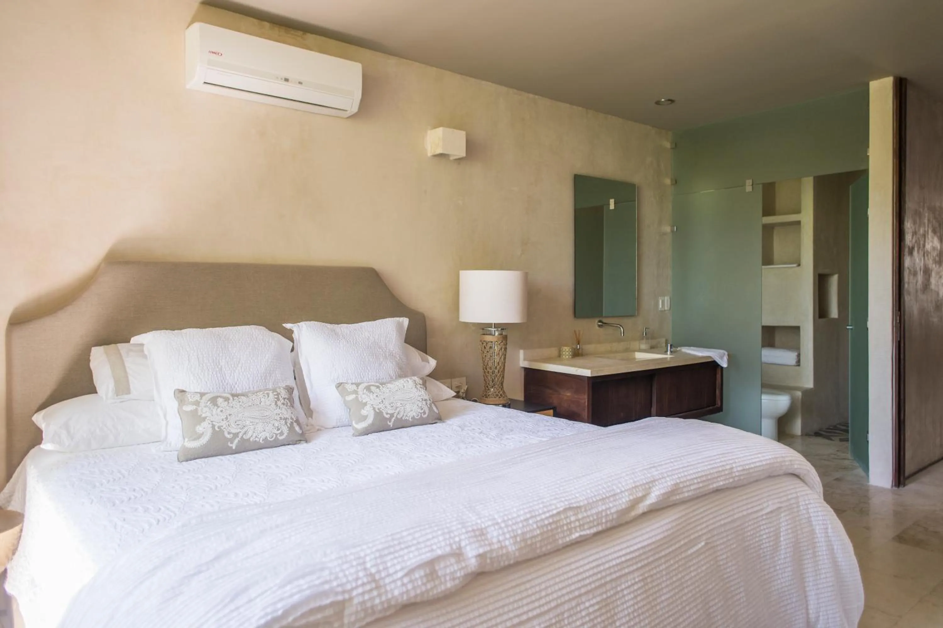 Bathroom, Bed in Eco-chic Design Condos Wrapped in Nature's Elements by Stella Rentals
