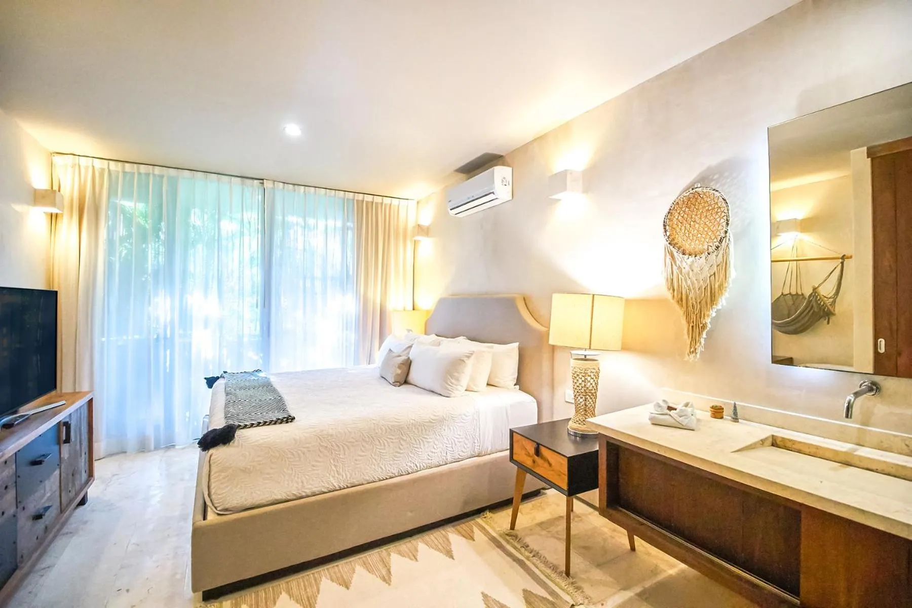 Bedroom, Bed in Eco-chic Design Condos Wrapped in Nature's Elements by Stella Rentals