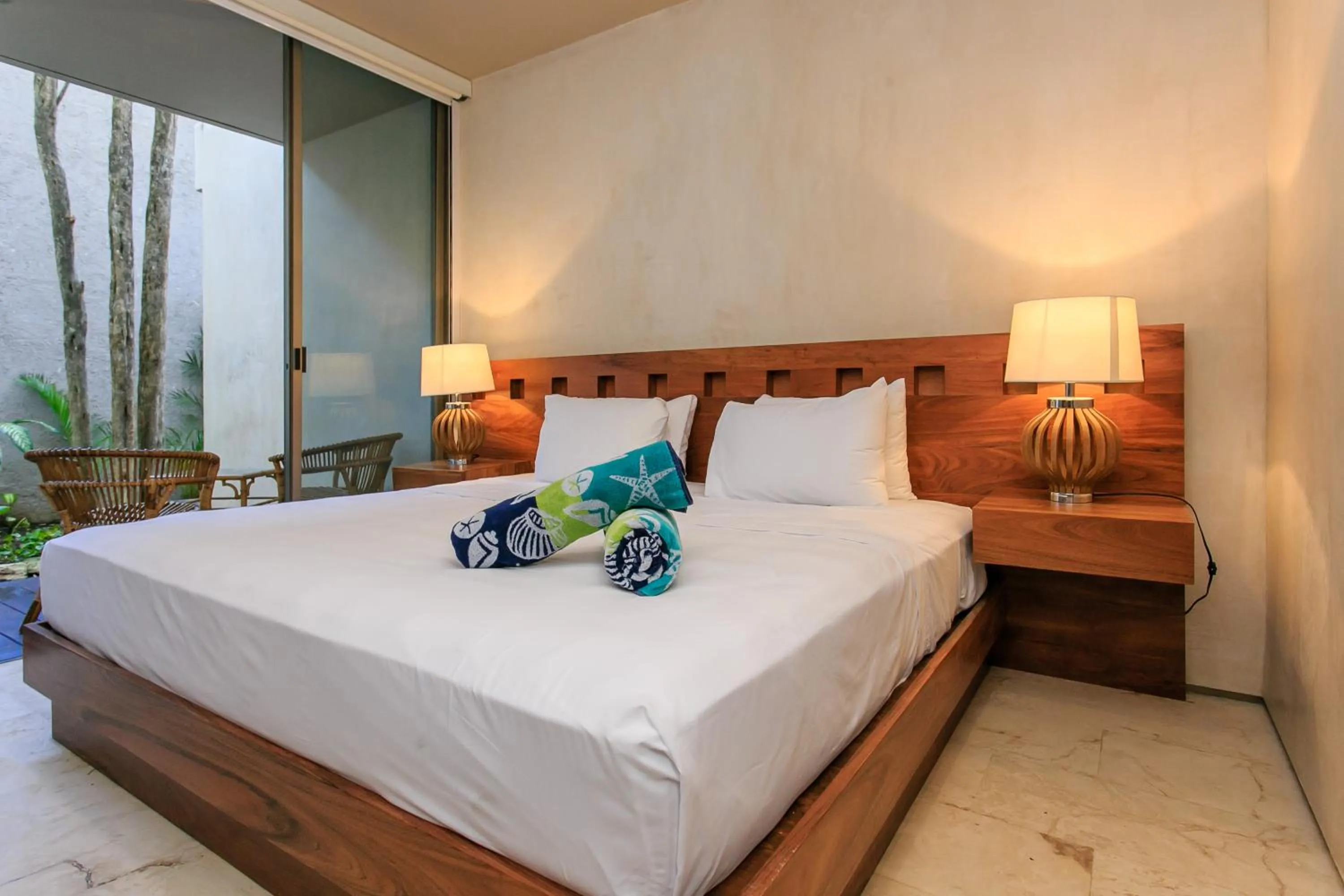 Balcony/Terrace, Bed in Eco-chic Design Condos Wrapped in Nature's Elements by Stella Rentals