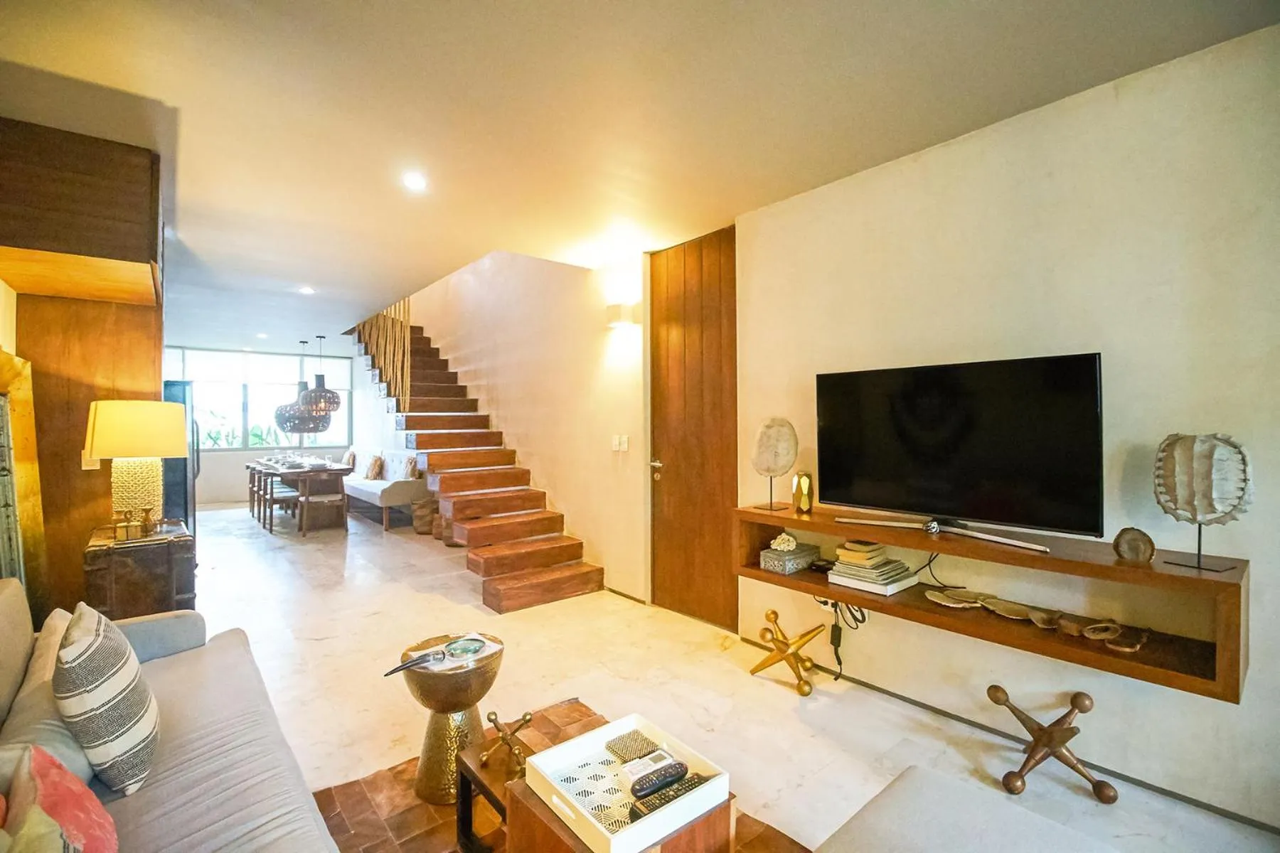 Living room in Eco-chic Design Condos Wrapped in Nature's Elements by Stella Rentals