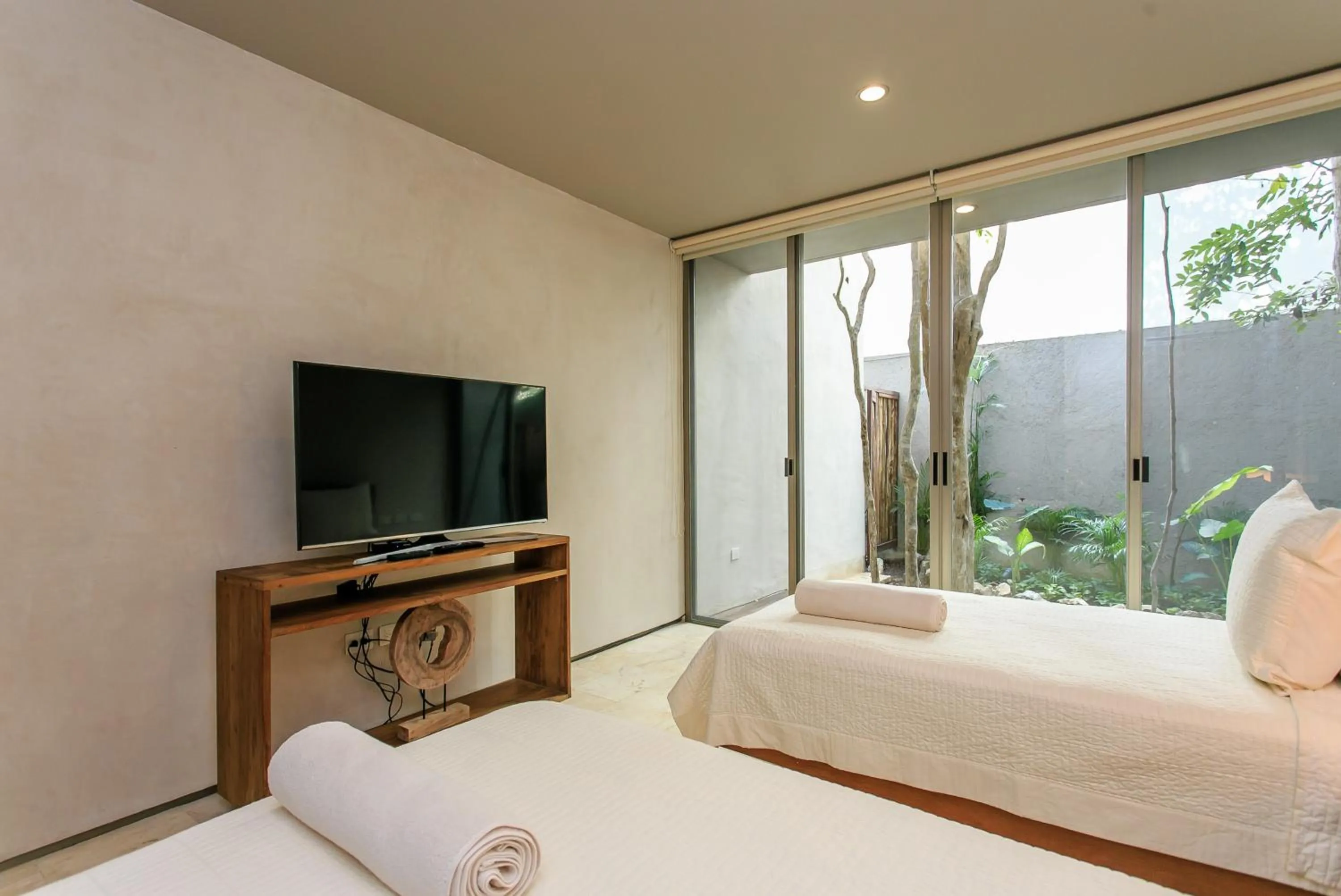 Balcony/Terrace, Bed in Eco-chic Design Condos Wrapped in Nature's Elements by Stella Rentals