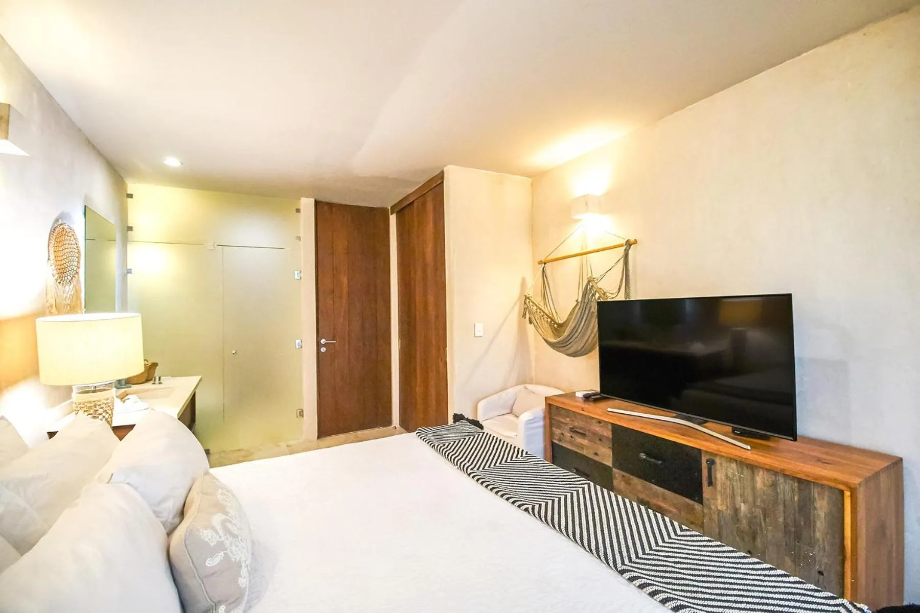 Bed in Eco-chic Design Condos Wrapped in Nature's Elements by Stella Rentals