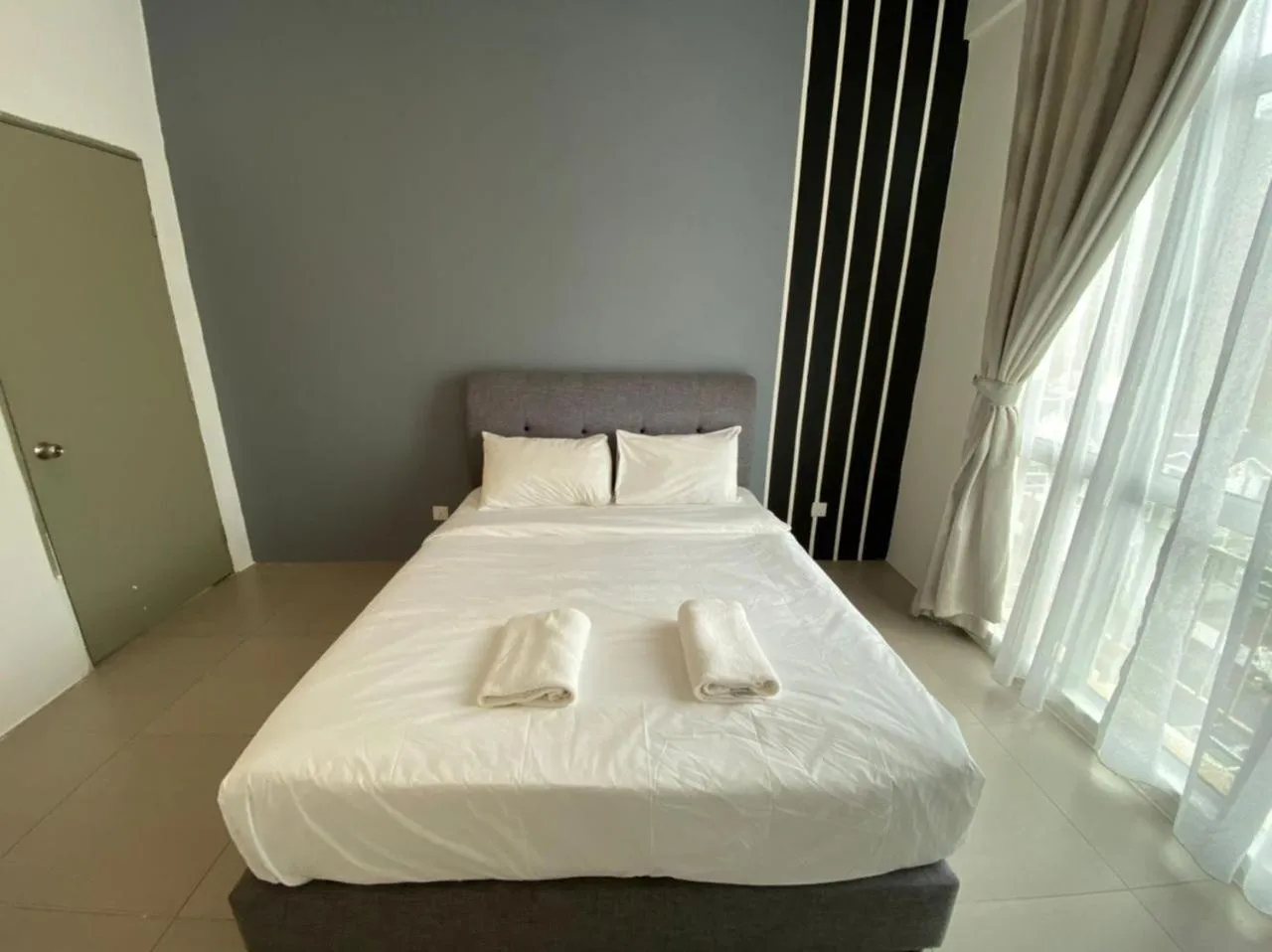 Bed in DreamScape Apartment @ Golden Hill