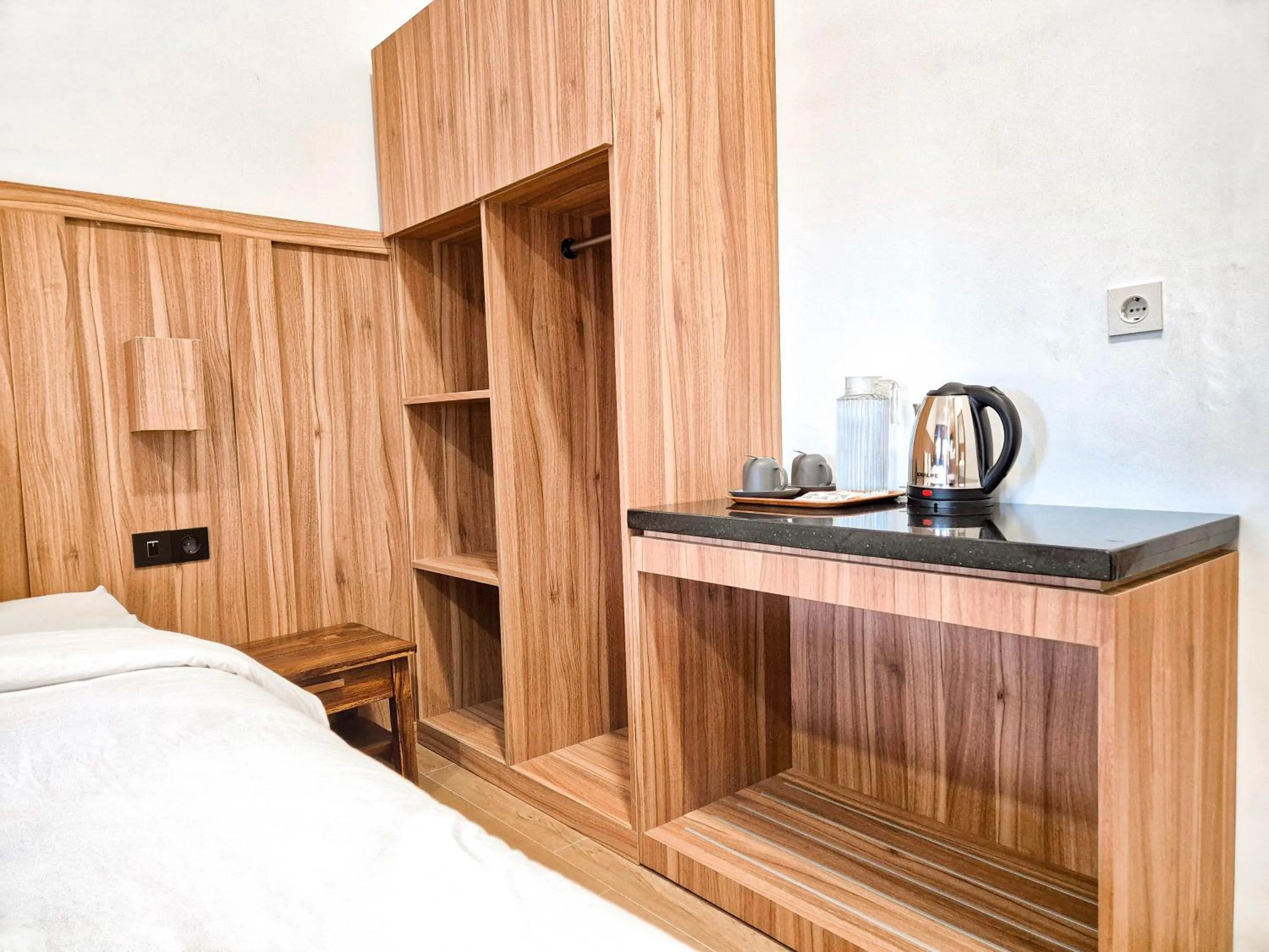 Bed in Pendhapa Art Space - PAS Limasan Homestay