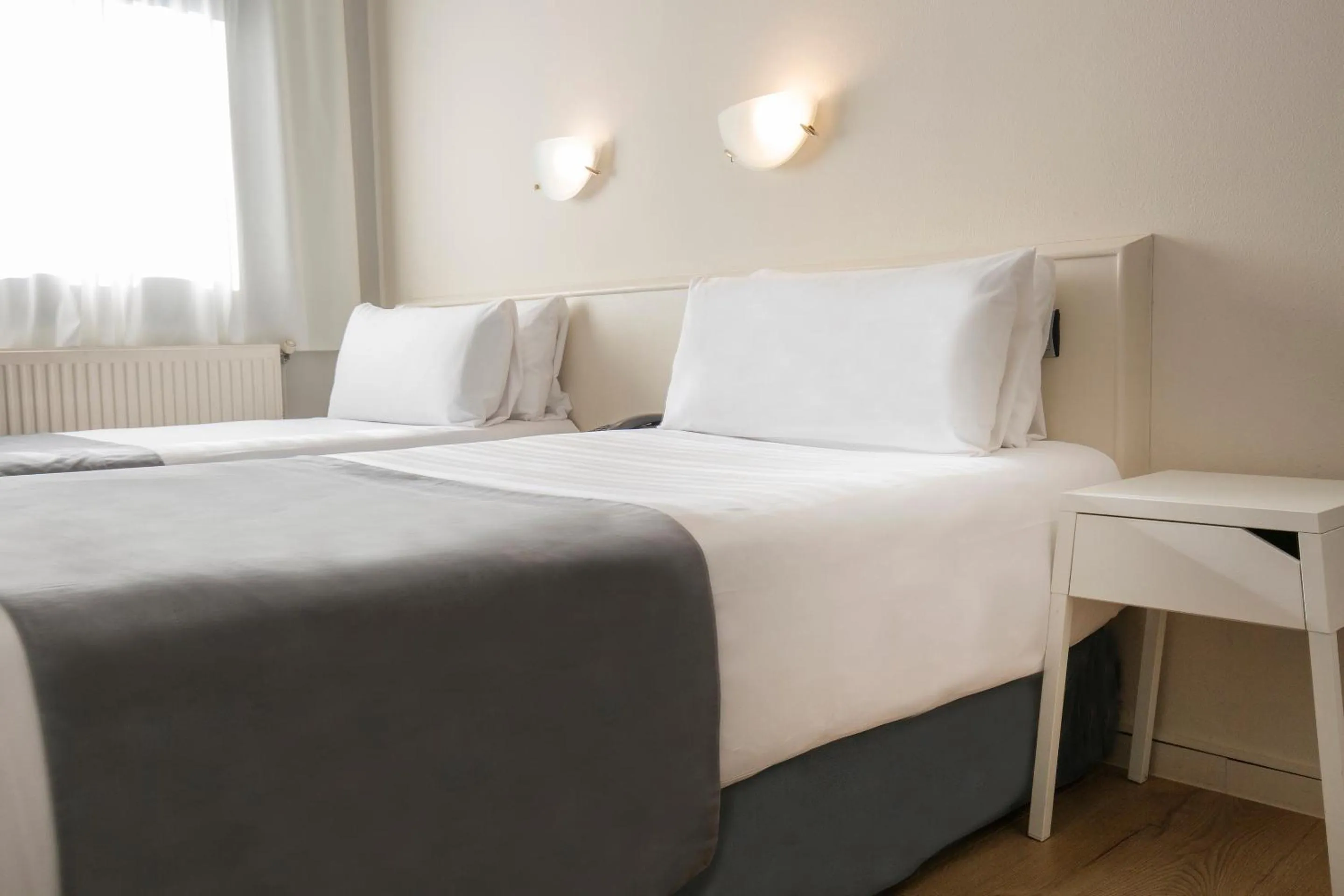 Bed in Hotel Camellot by Nexta