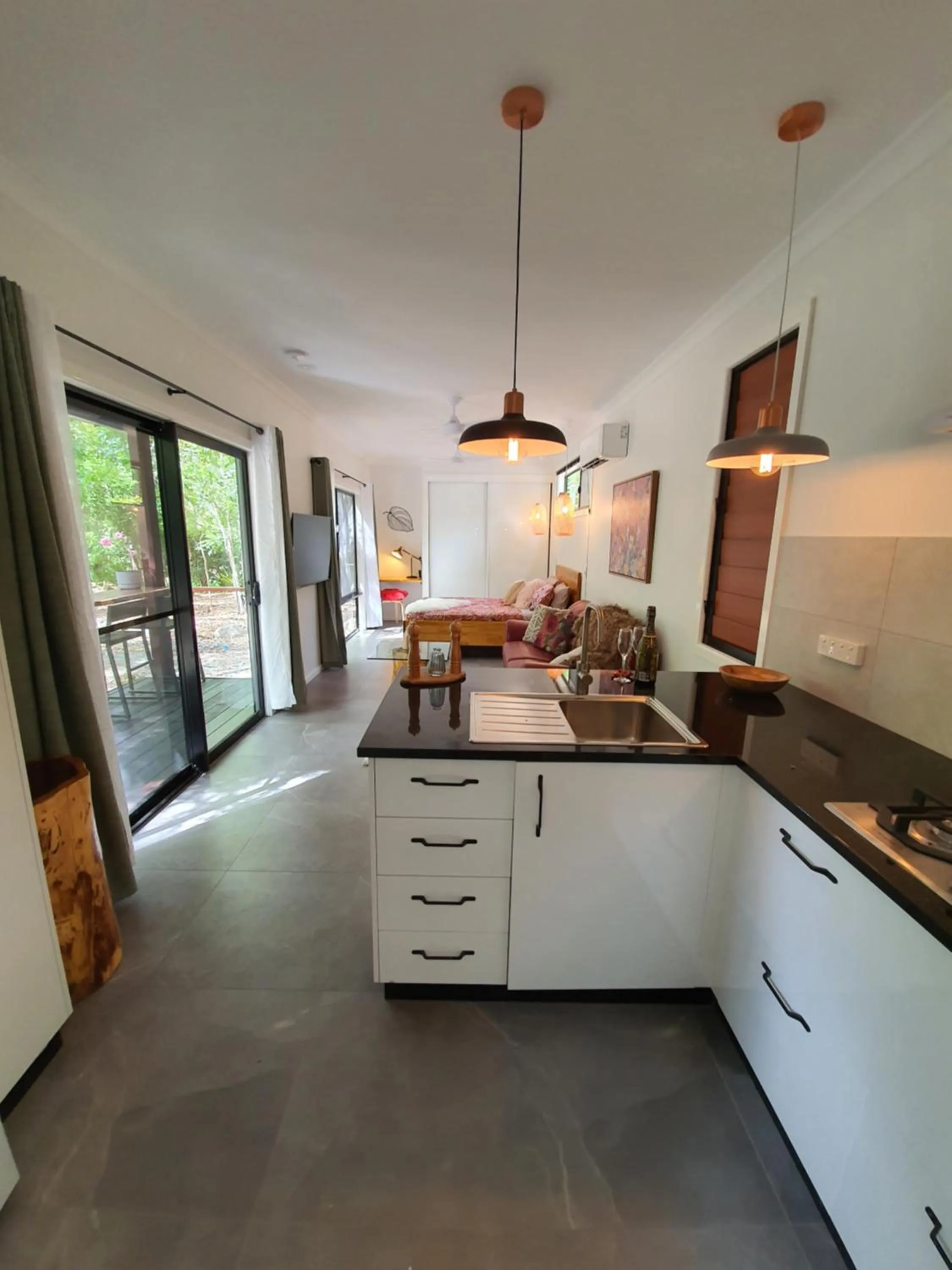 Kitchen or kitchenette in Airlie Beach Eco Cabins - Adults Only