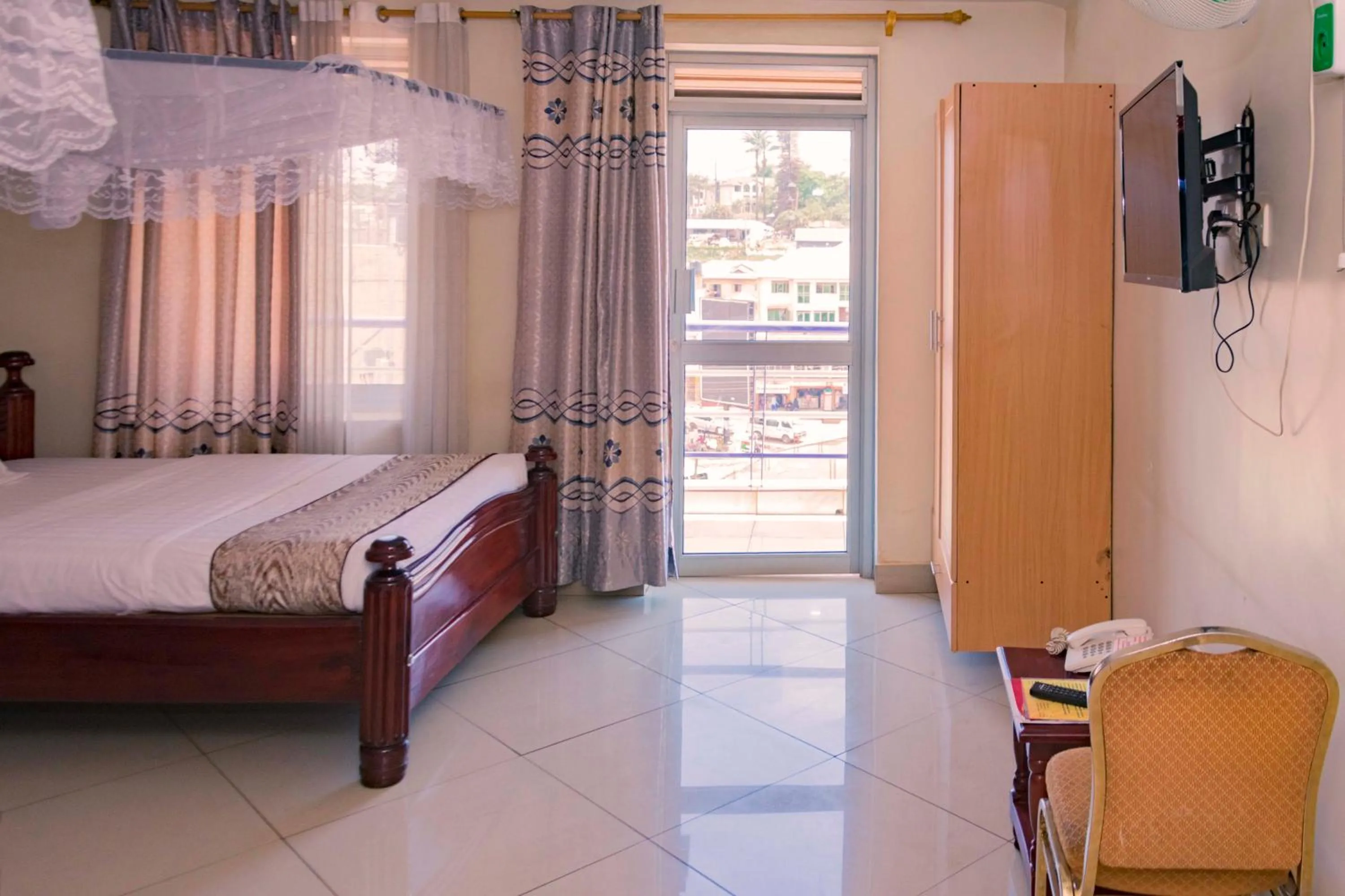 TV and multimedia, Bed in G-One Hotel Kampala