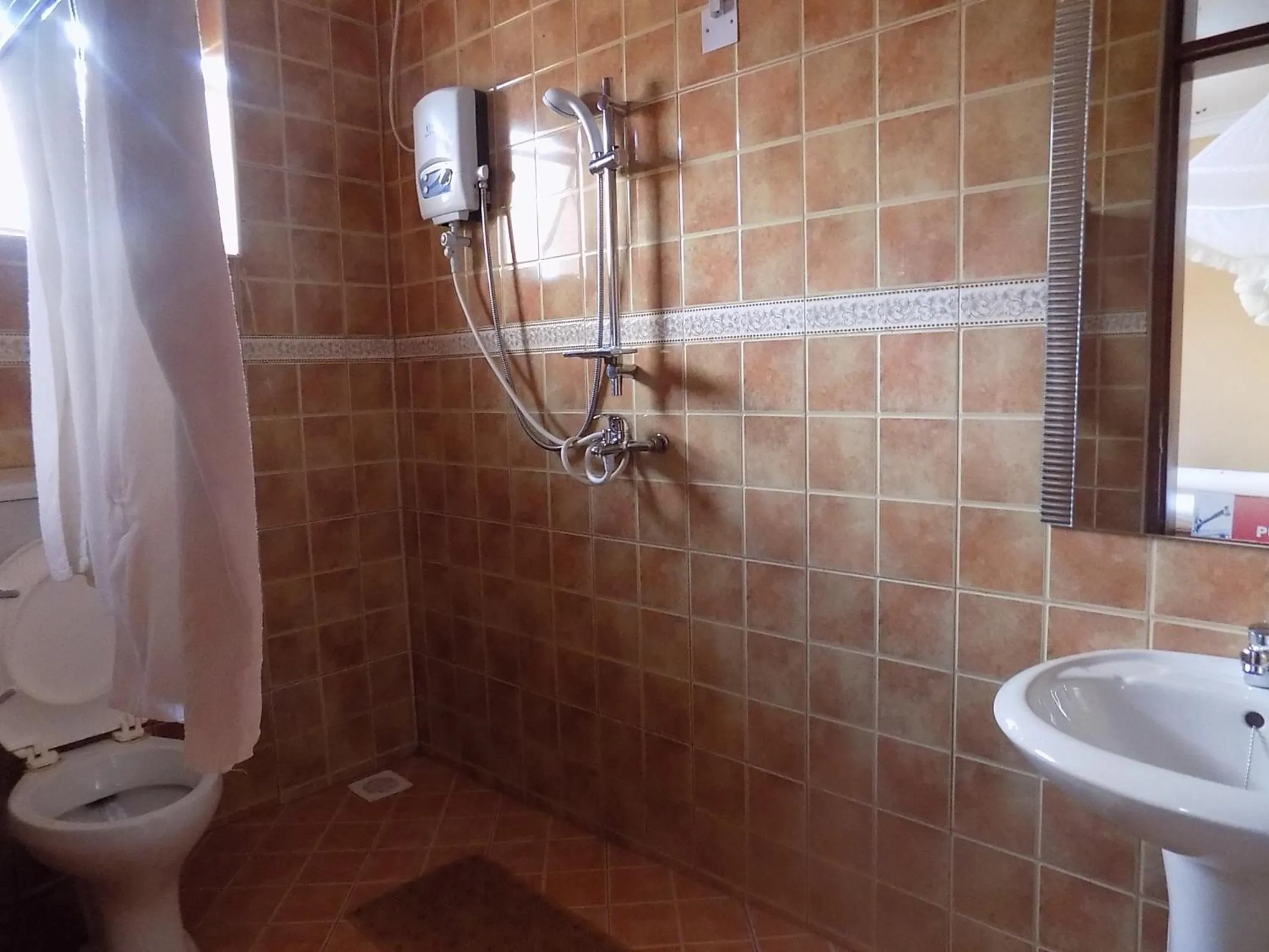 Bathroom in Olina Hotel and Apartments Kampala