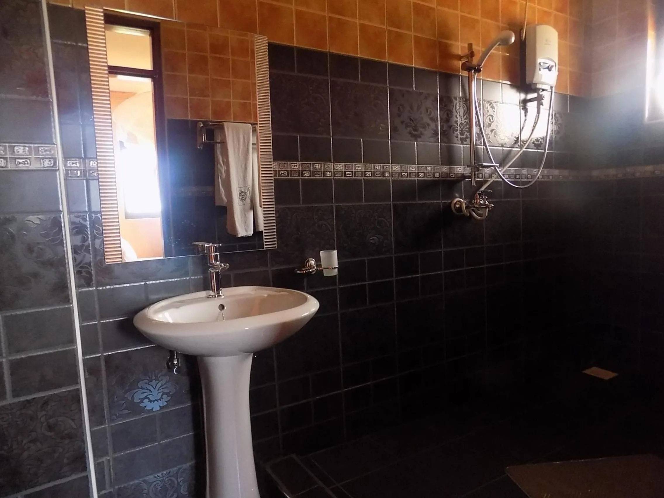 Bathroom in Olina Hotel and Apartments Kampala