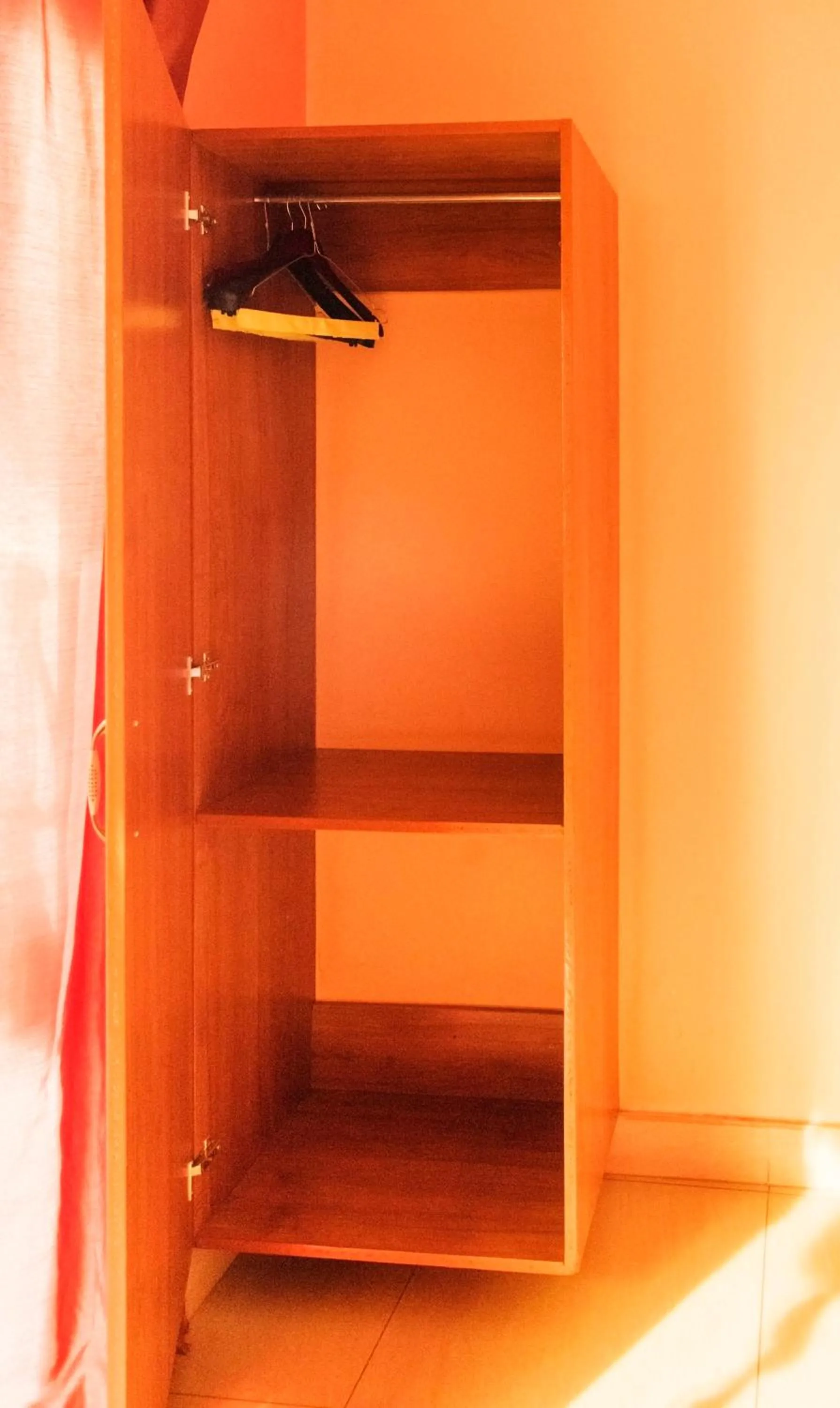 wardrobe in Olina Hotel and Apartments Kampala