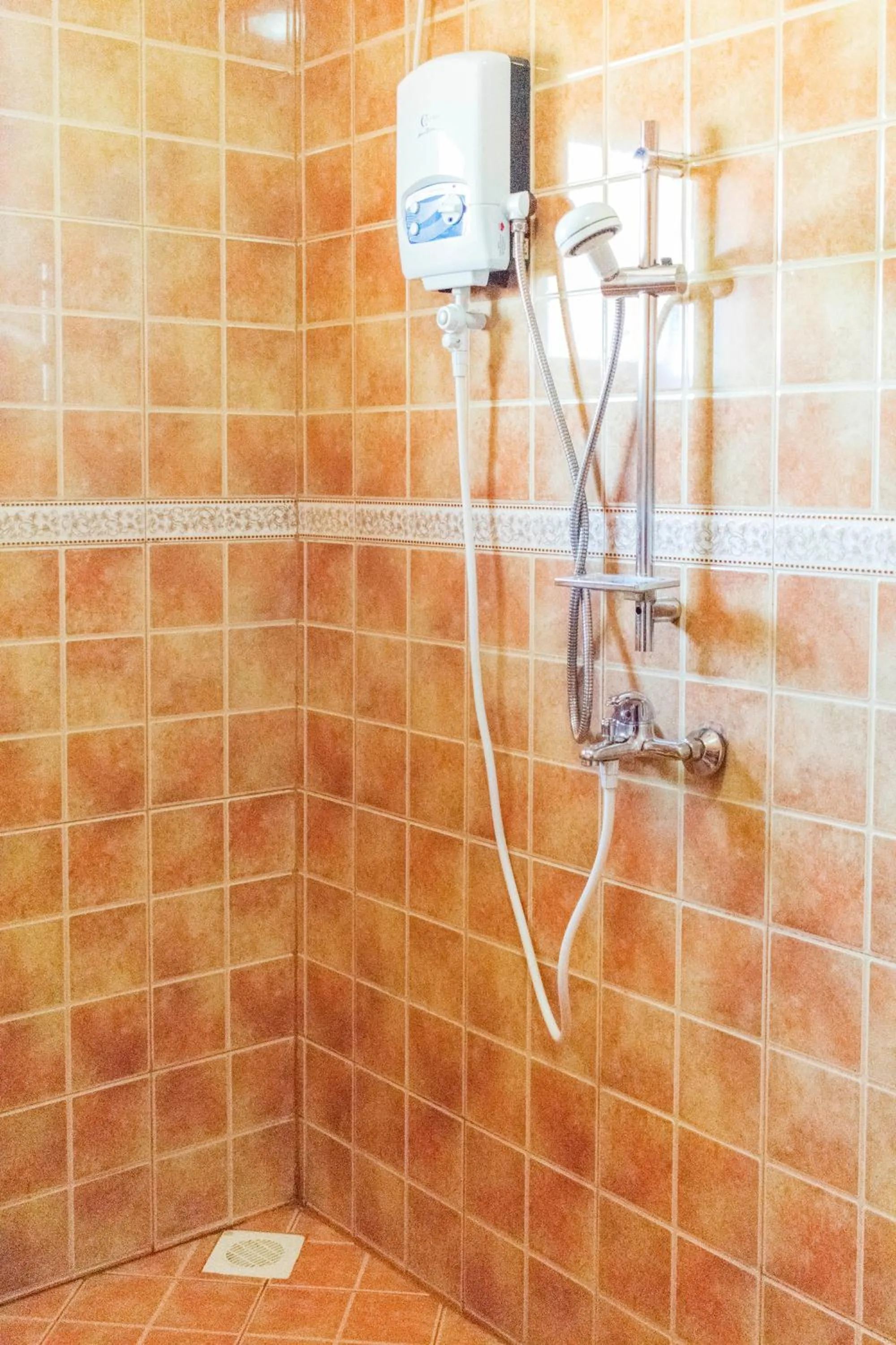 Shower in Olina Hotel and Apartments Kampala
