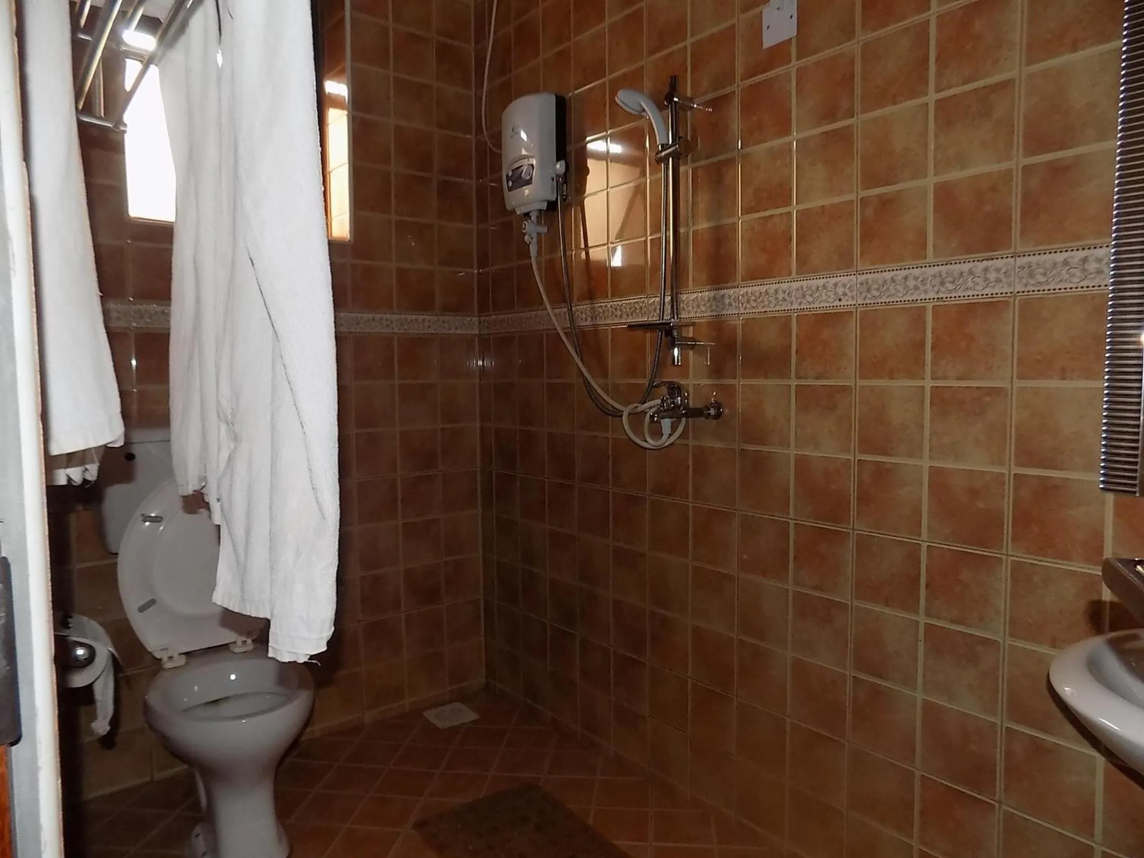 Bathroom in Olina Hotel and Apartments Kampala