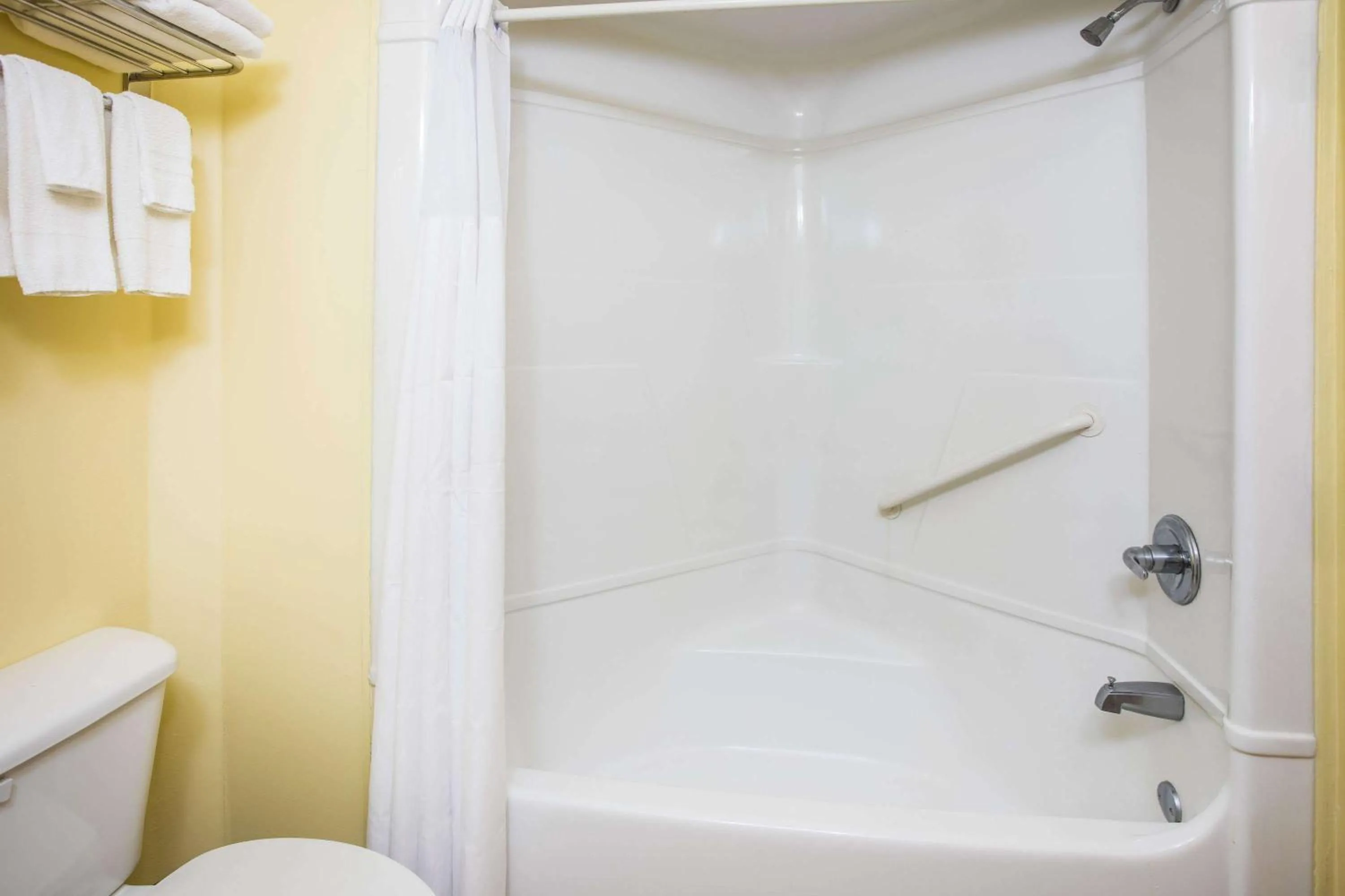 Bathroom in Days Inn & Suites by Wyndham Augusta Near Fort Eisenhower