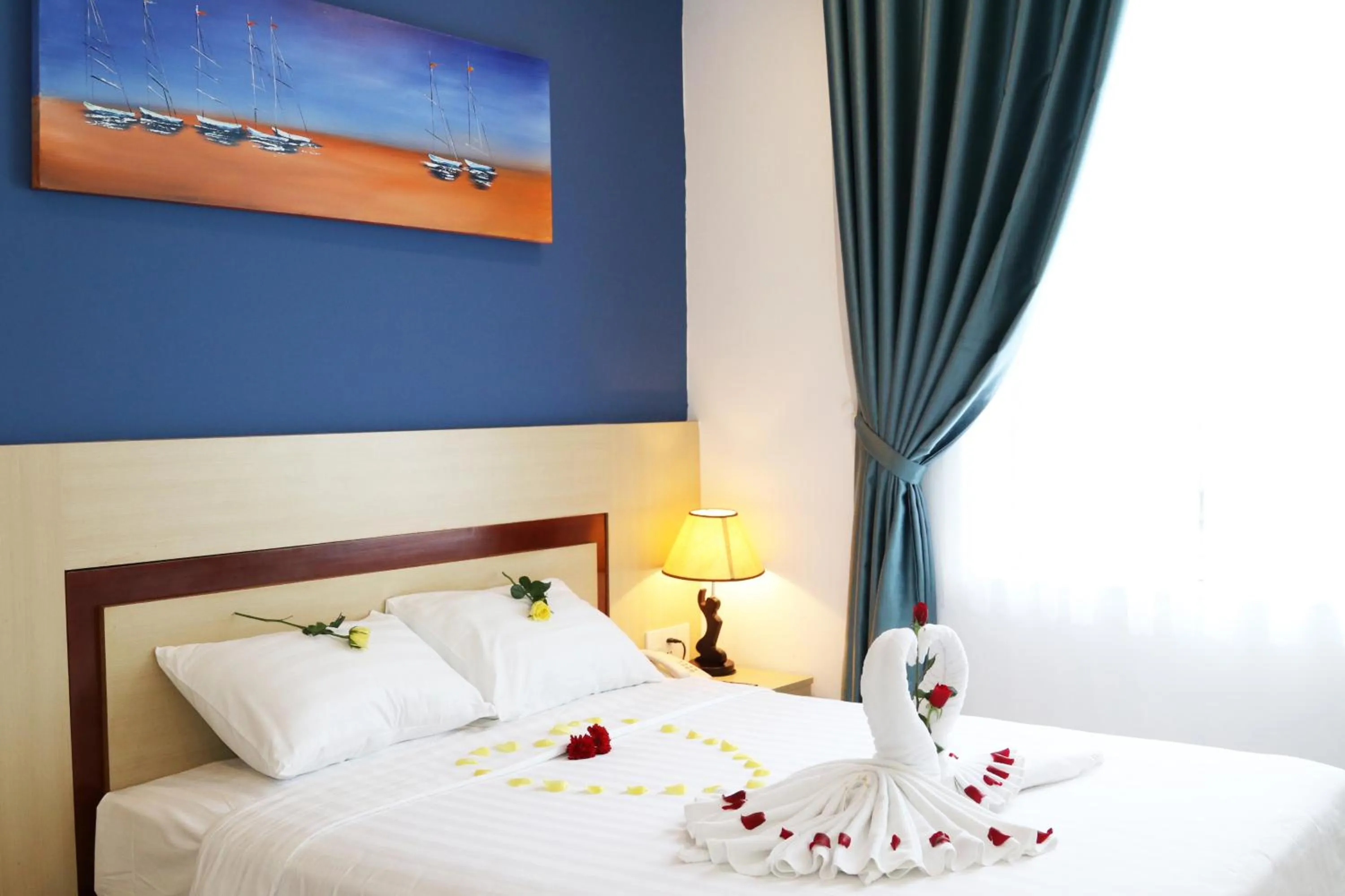 Bed in Maxhome Luxury Hotel