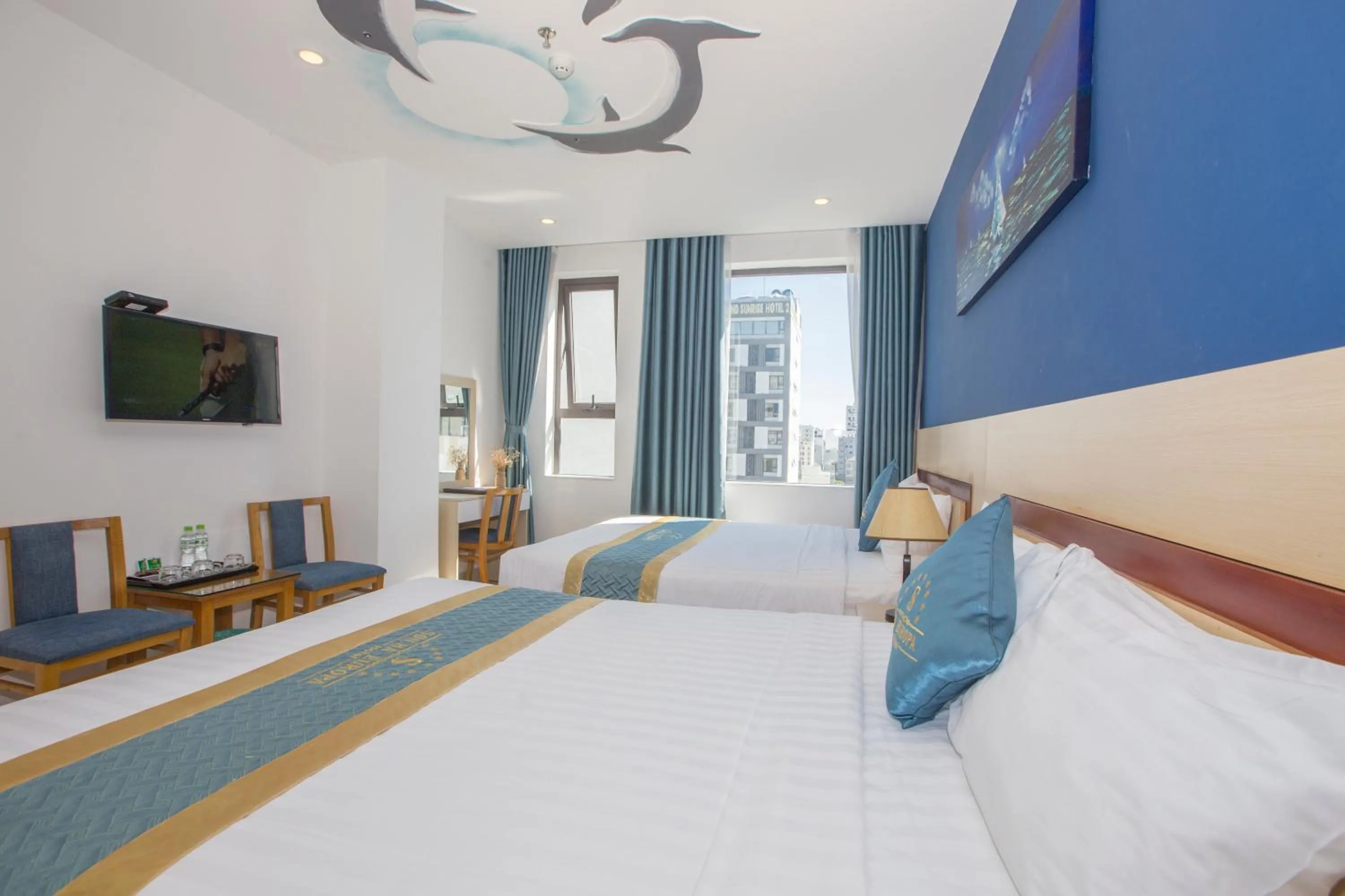 Bed in Maxhome Luxury Hotel