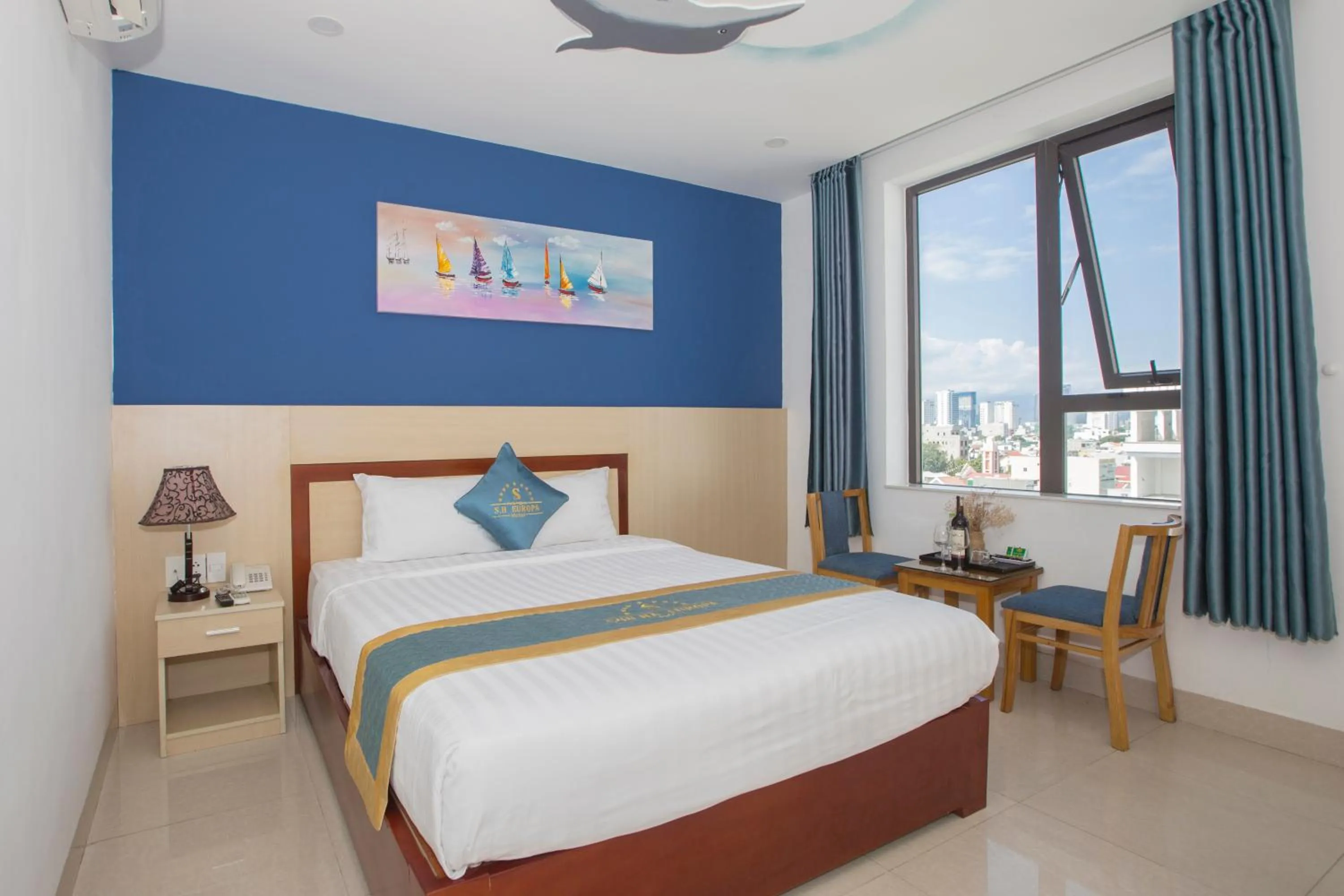 Bed in Maxhome Luxury Hotel