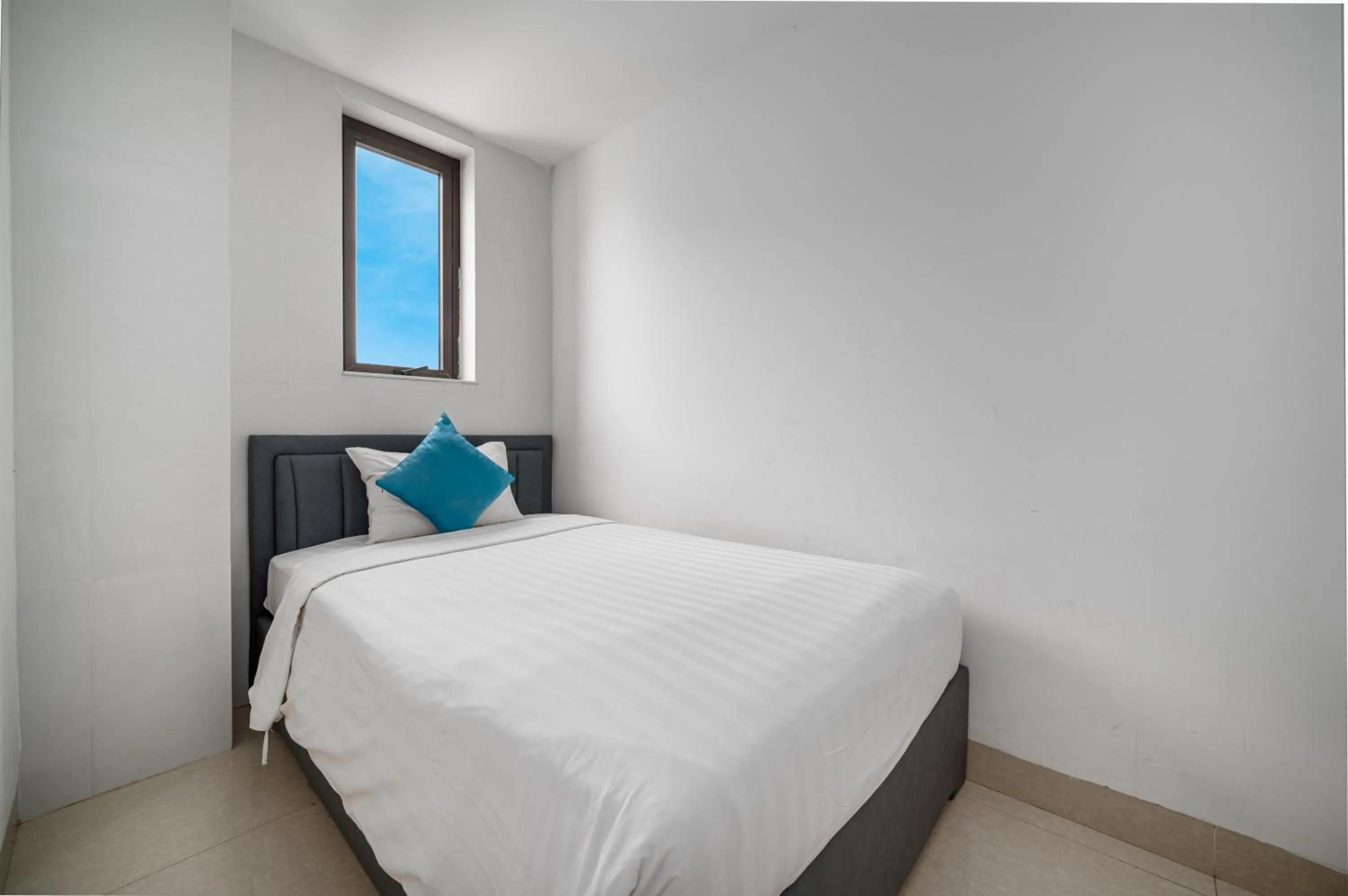 Bed in Maxhome Luxury Hotel