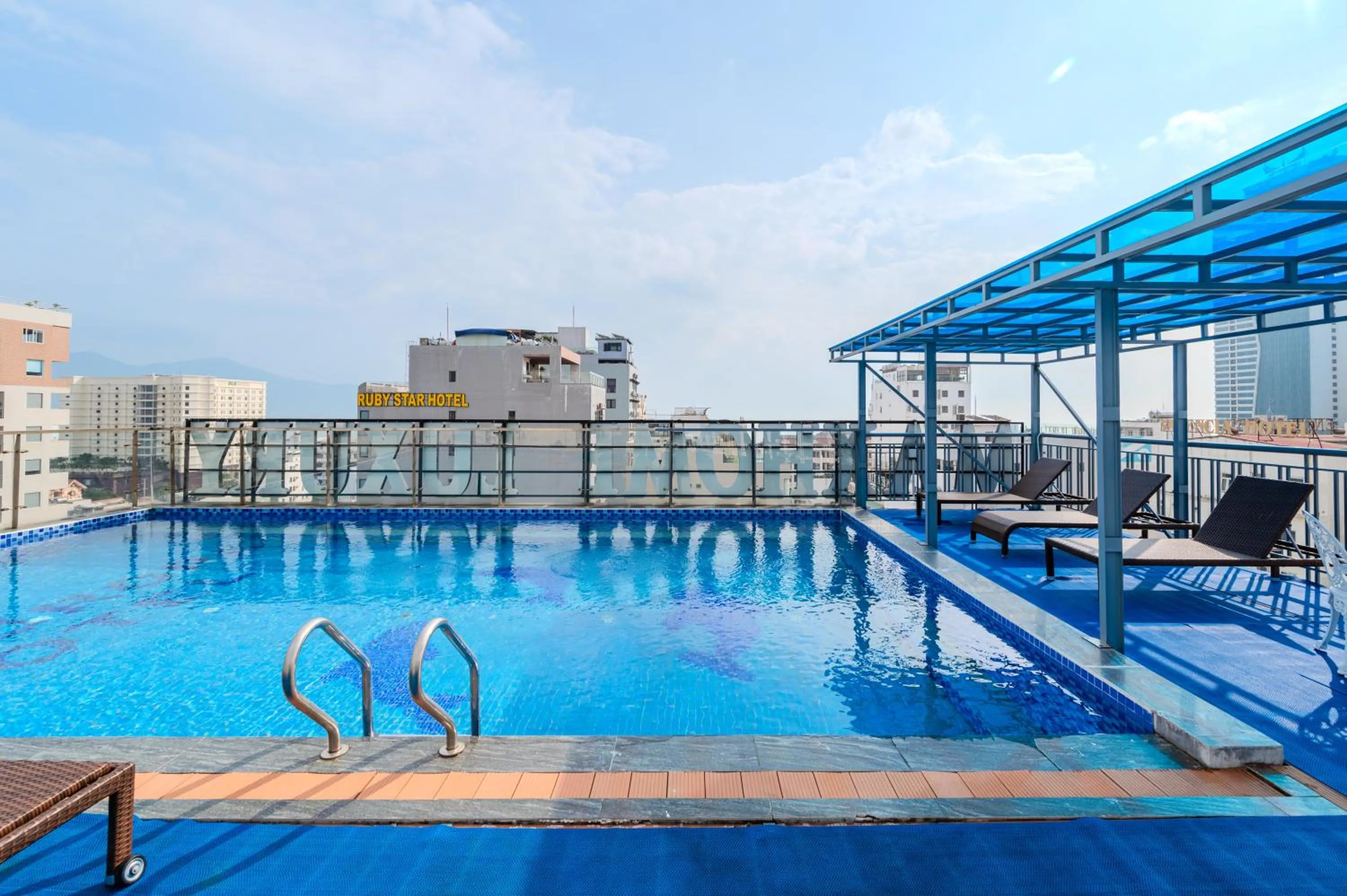 Swimming pool in Maxhome Luxury Hotel