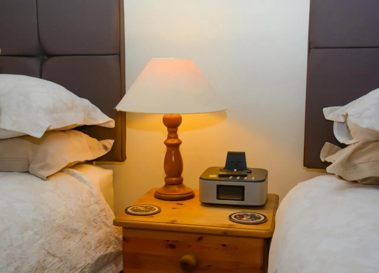 Bedroom, Bed in Clarke Cottage Guest House