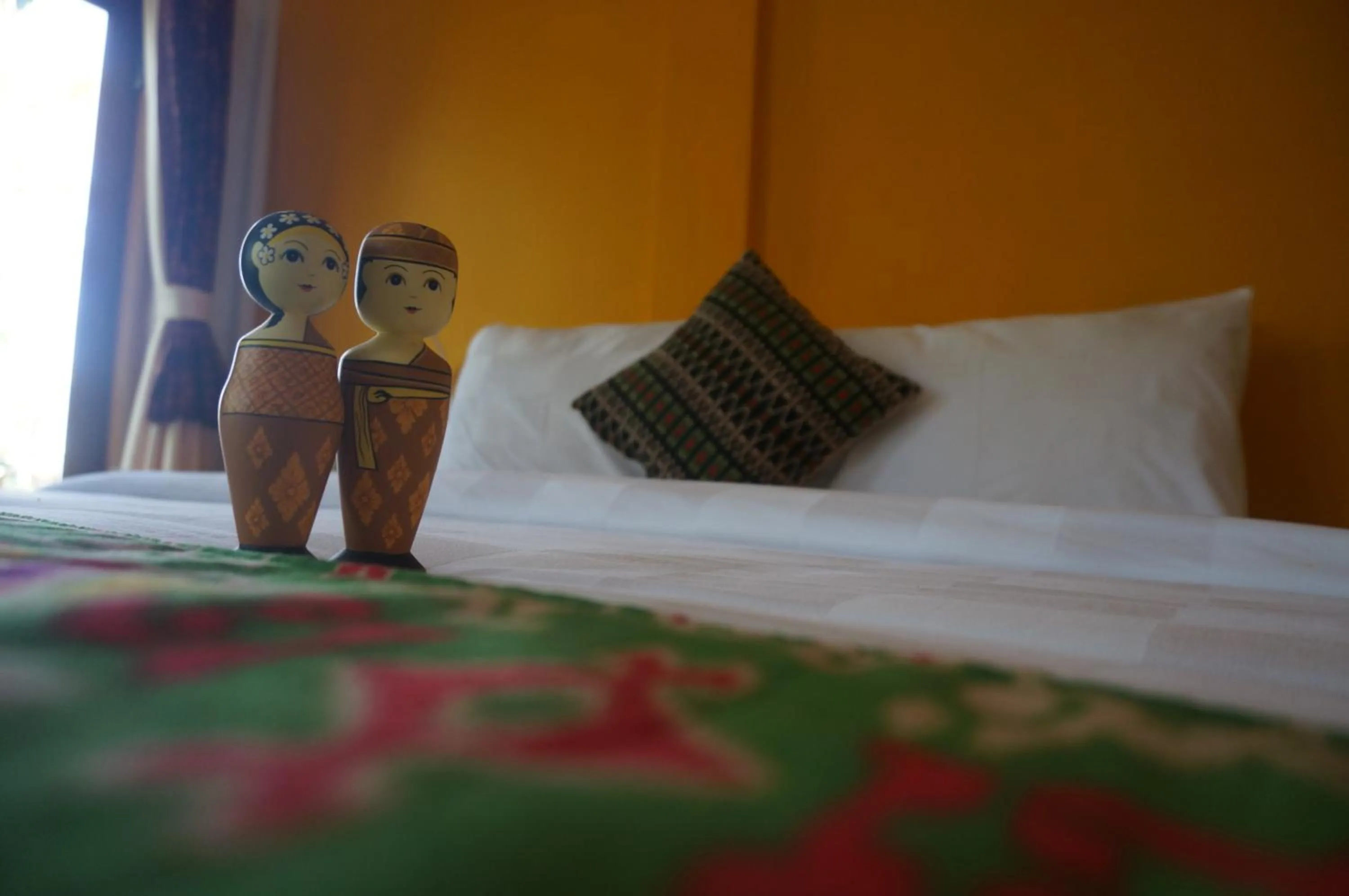 Bed in Manggis Garden Dive Resort