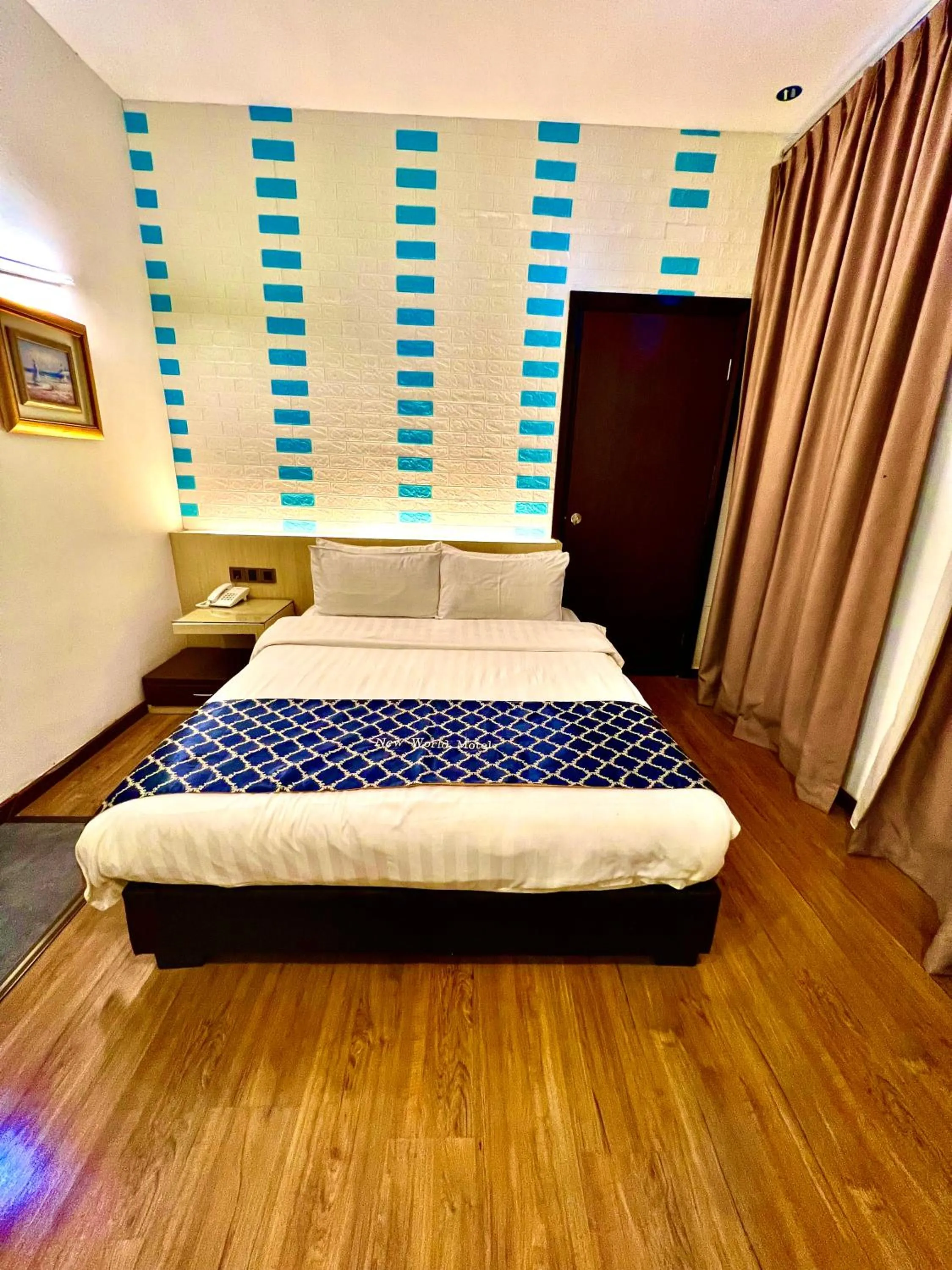 Bed in New World Express Motel