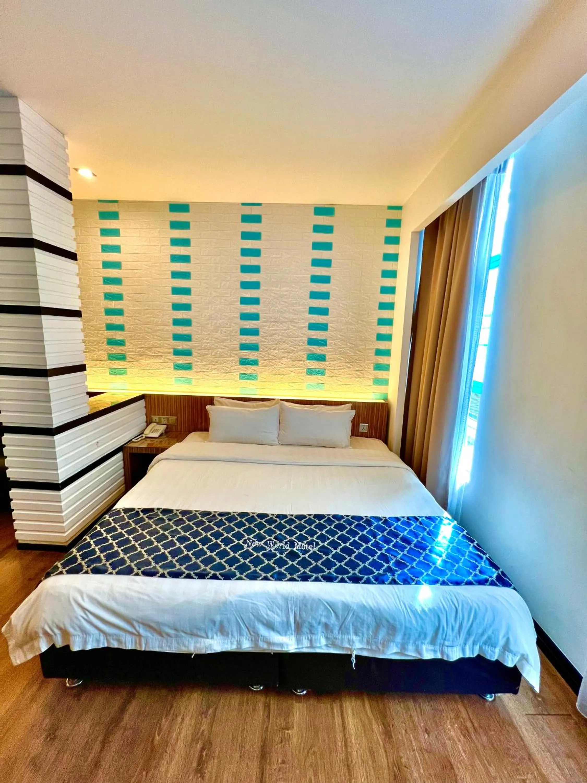 Bed in New World Express Motel