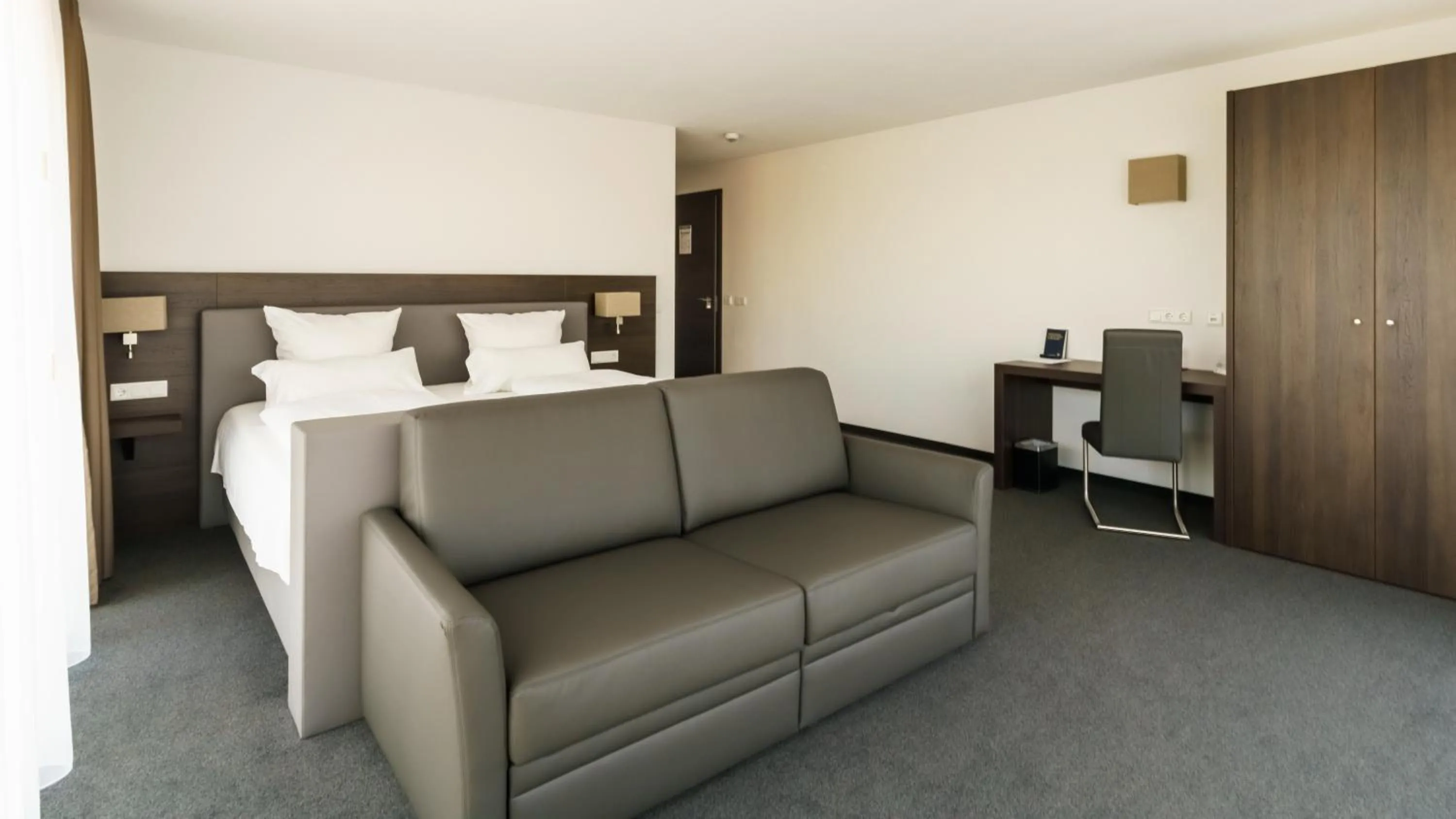 Seating area, Bed in Hotel Duda Langenbruck