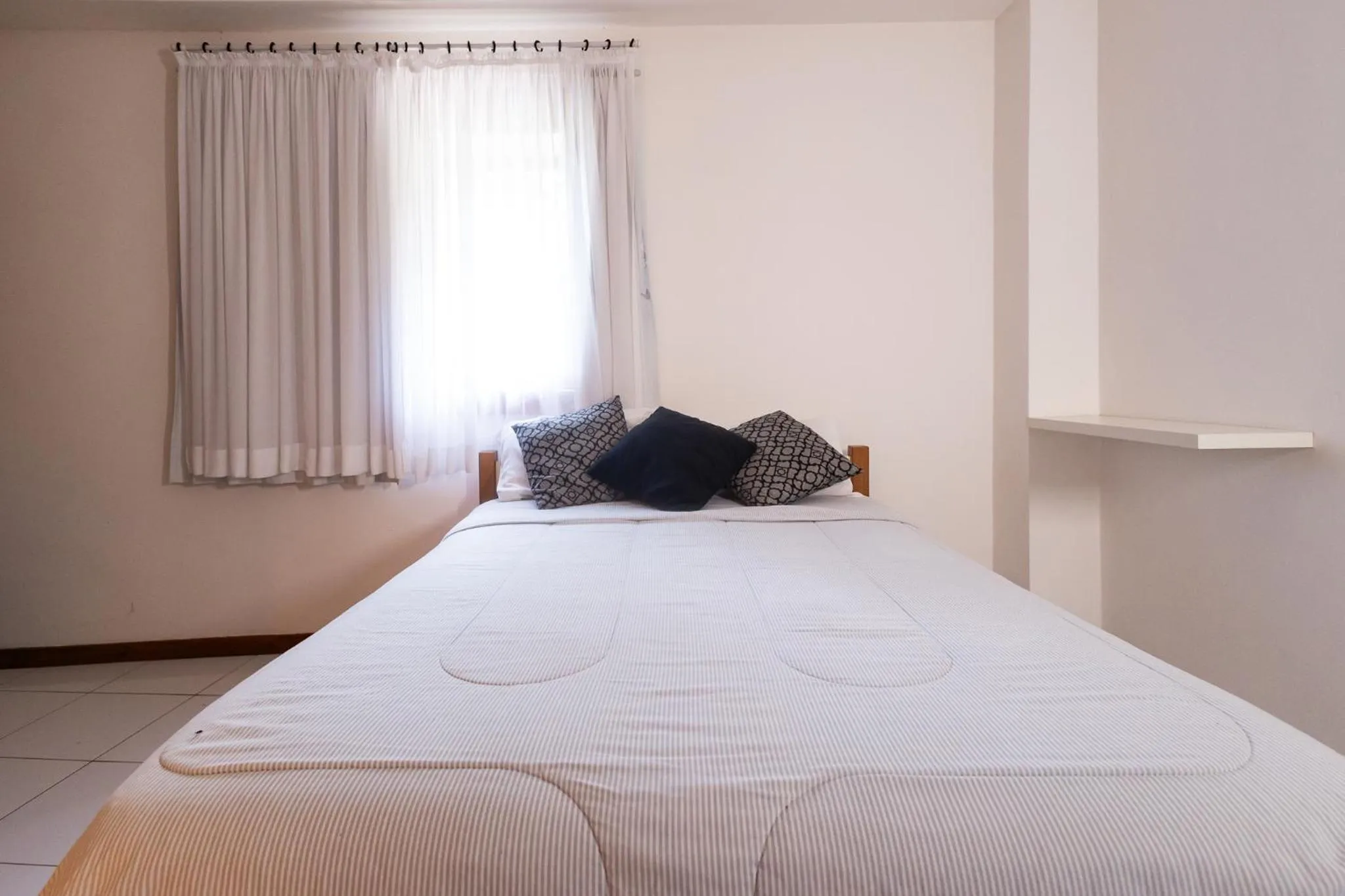 Bedroom, Bed in Putini Pousada e Hotel by OYO