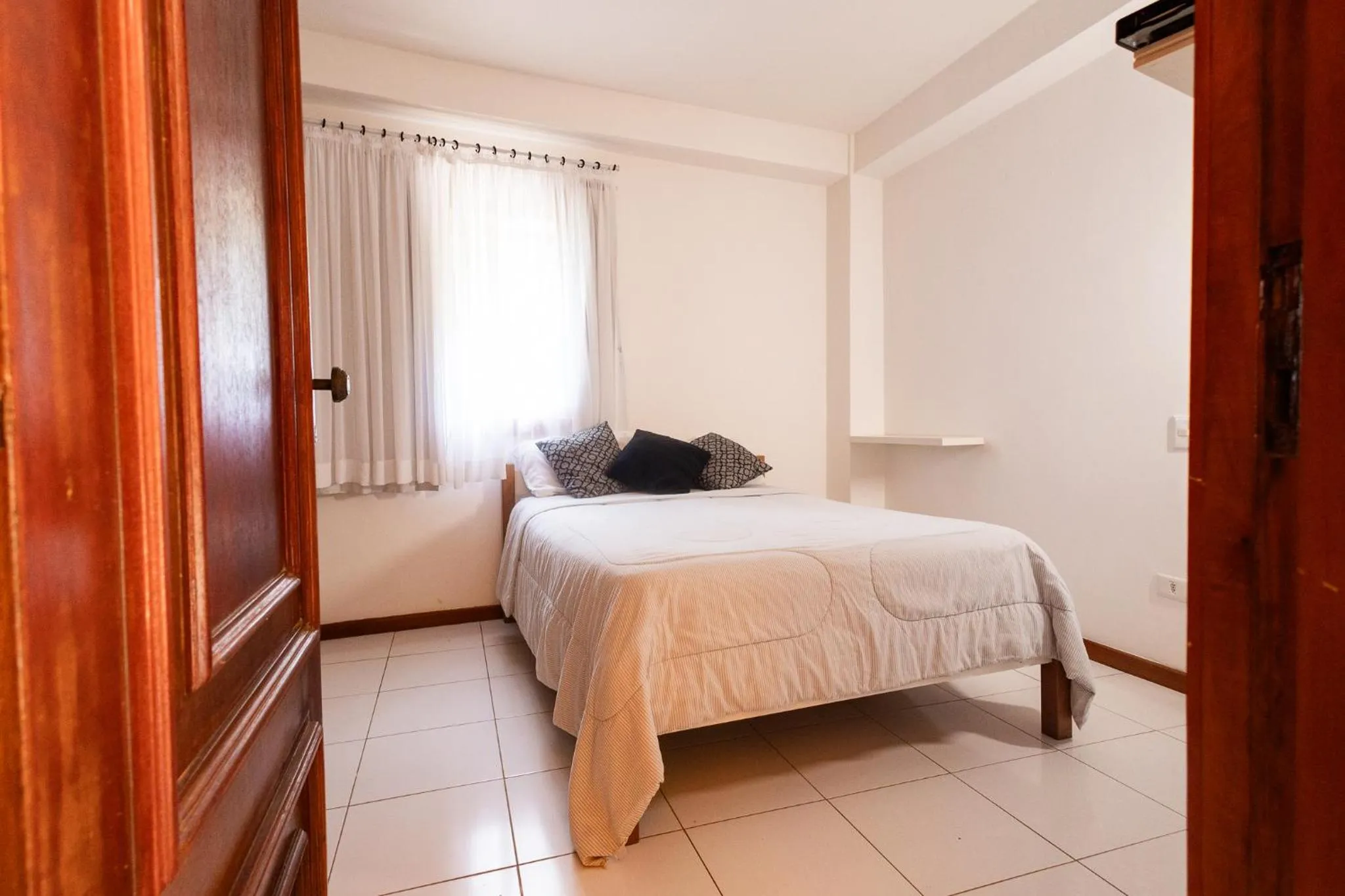 Bedroom, Bed in Putini Pousada e Hotel by OYO