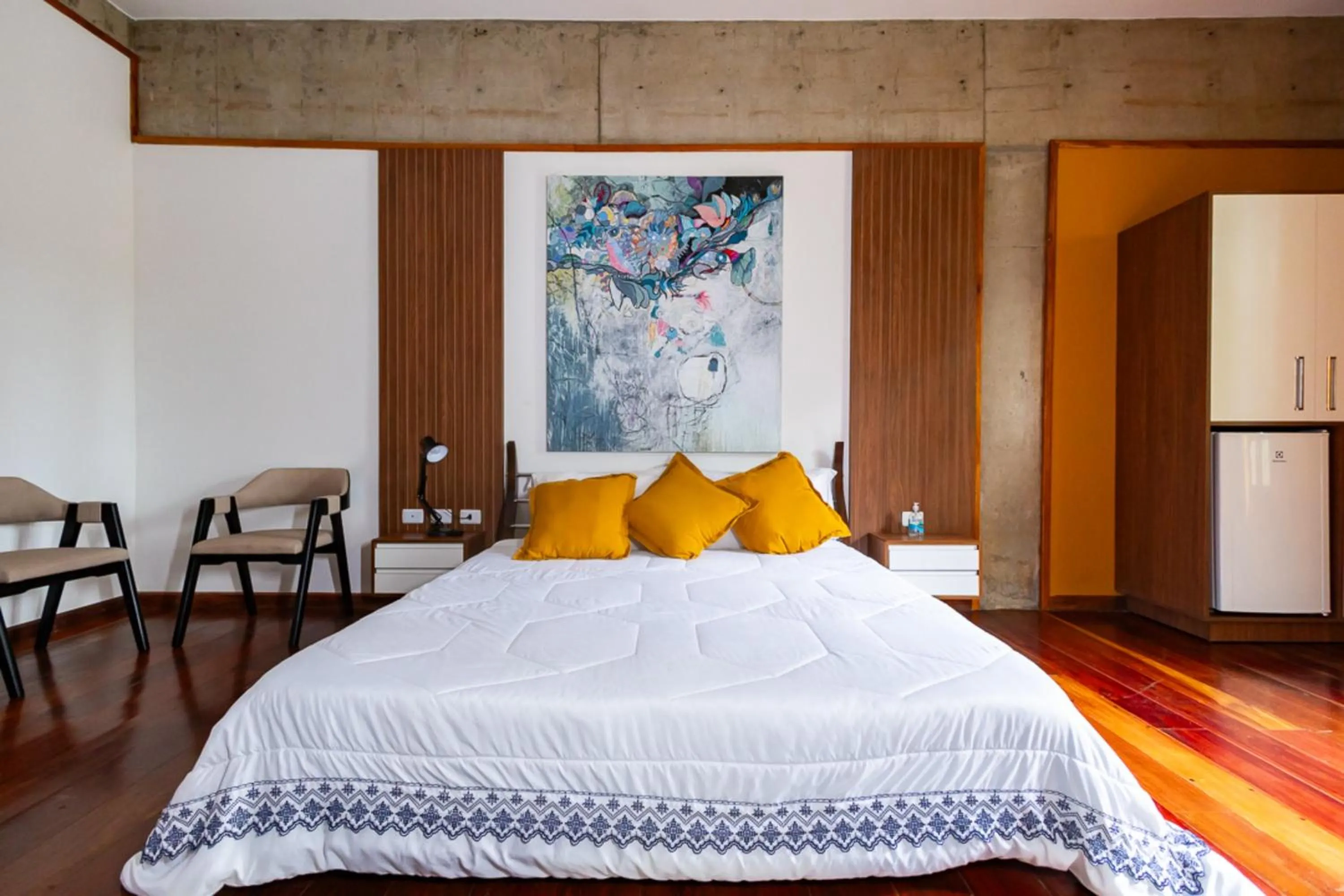 Bedroom, Bed in Putini Pousada e Hotel by OYO