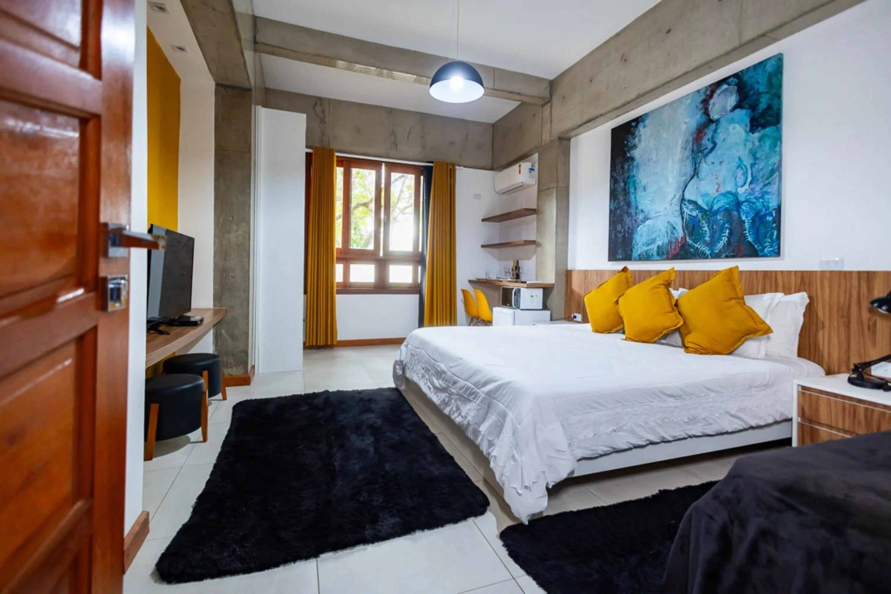 Bedroom, Bed in Putini Pousada e Hotel by OYO