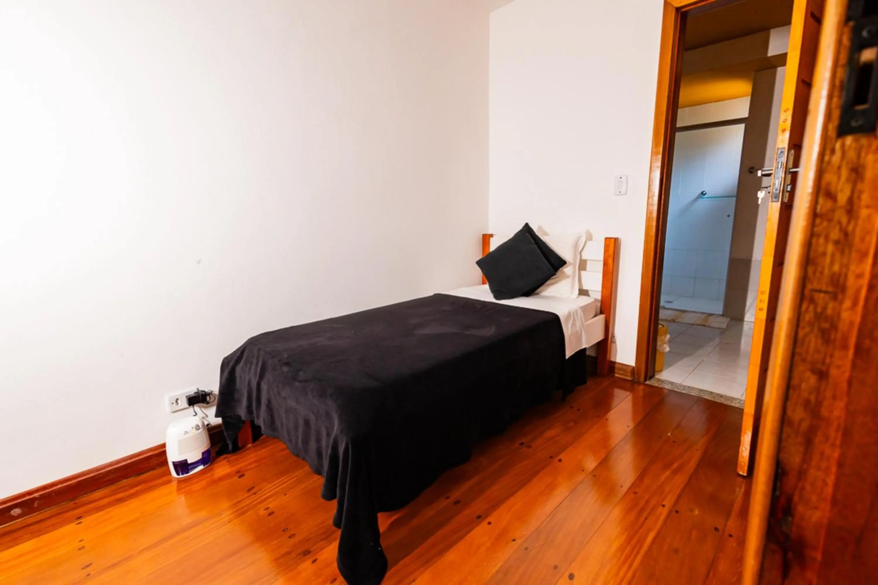 Bedroom, Bed in Putini Pousada e Hotel by OYO