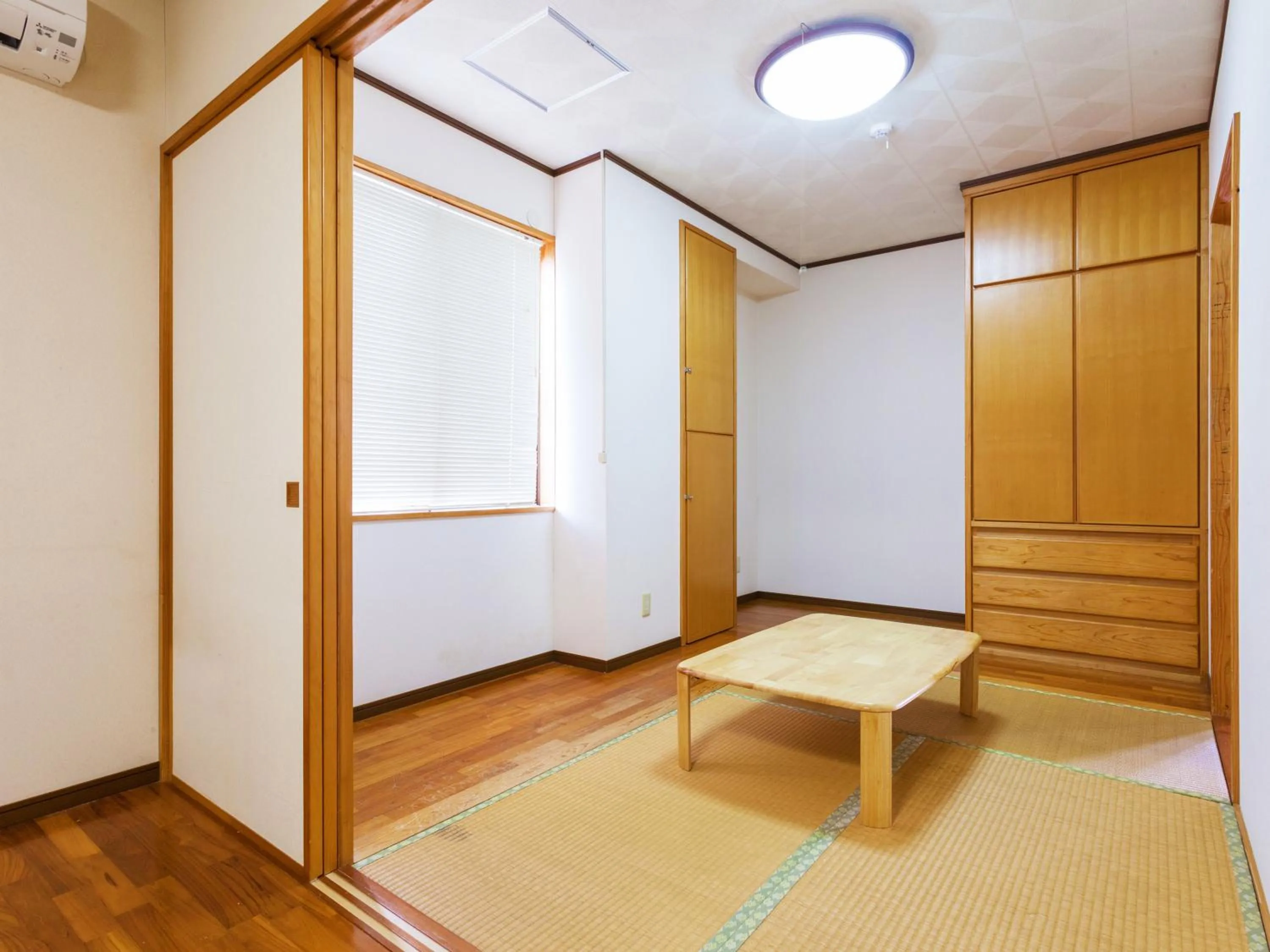 Bedroom in Kariyushi Condominium Resort Sea Side House