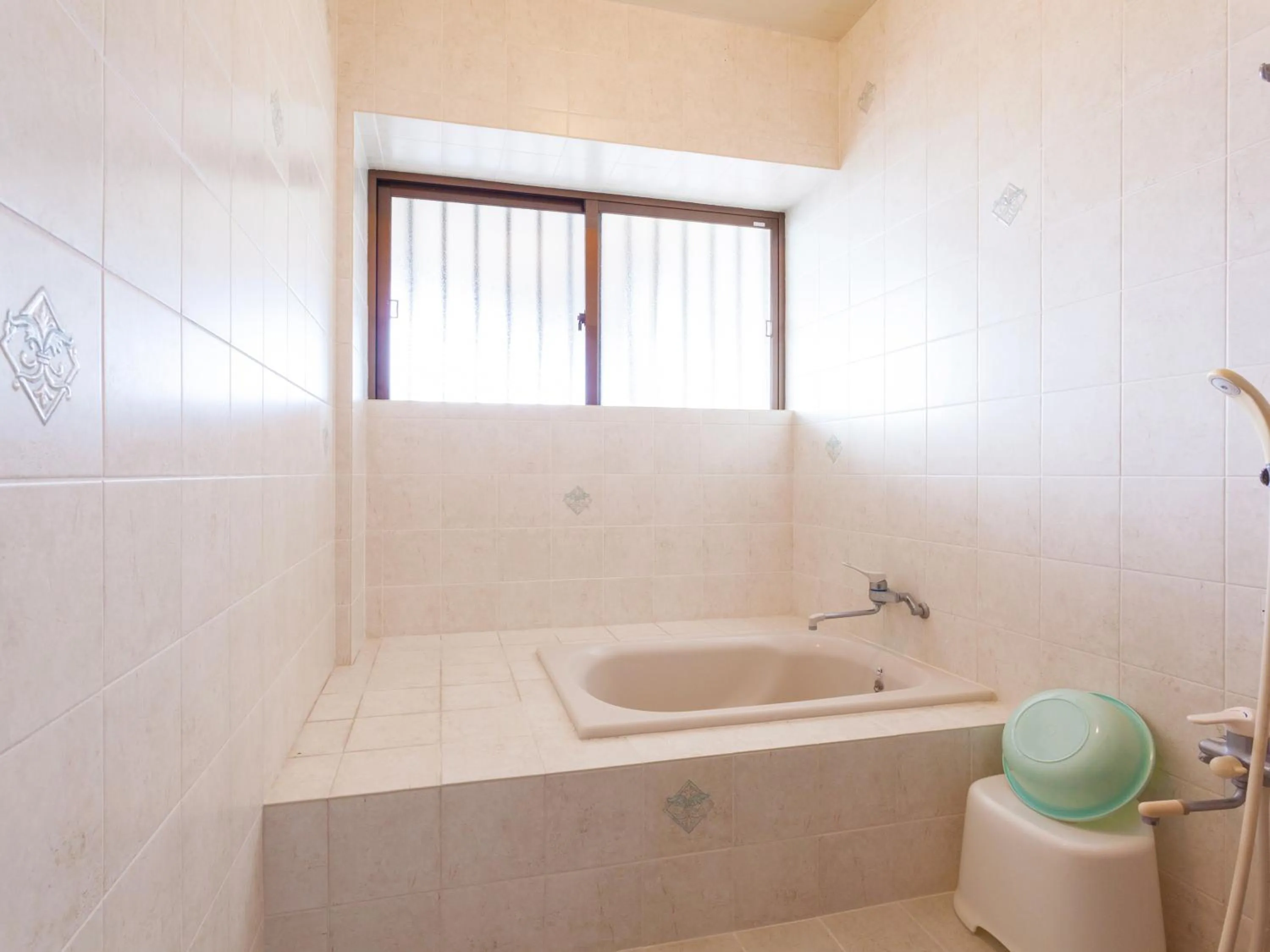 Shower in Kariyushi Condominium Resort Sea Side House