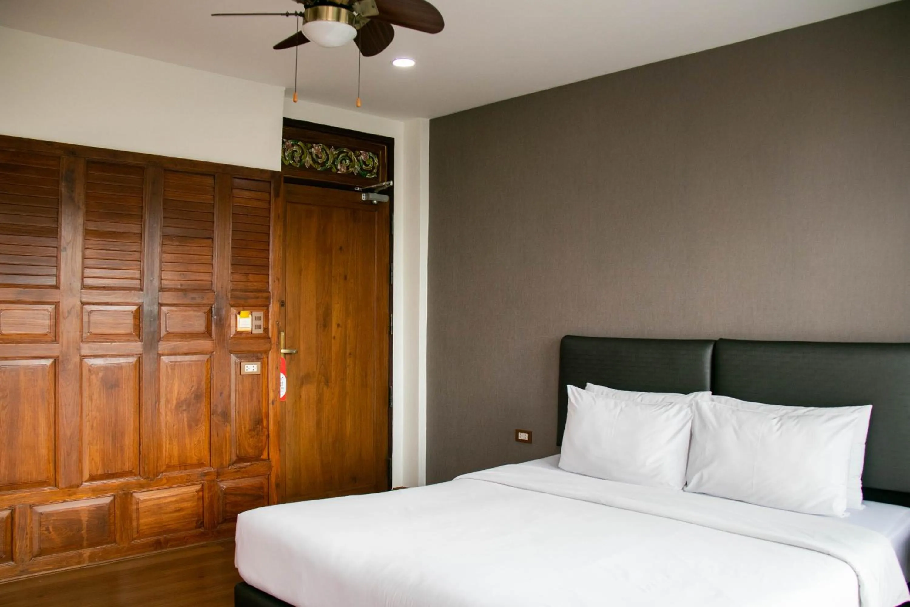 Bed in Lamphu Tree House Boutique Hotel