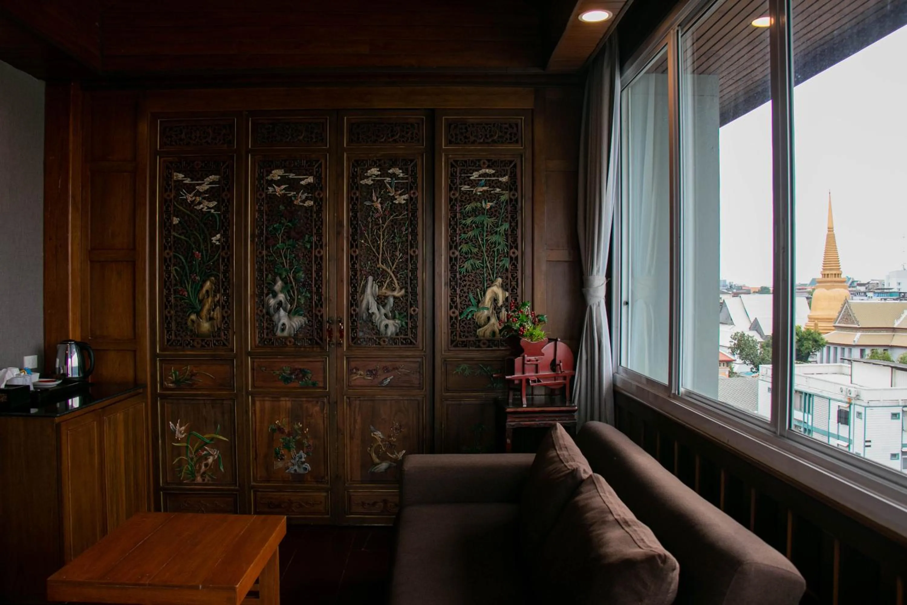Living room in Lamphu Tree House Boutique Hotel
