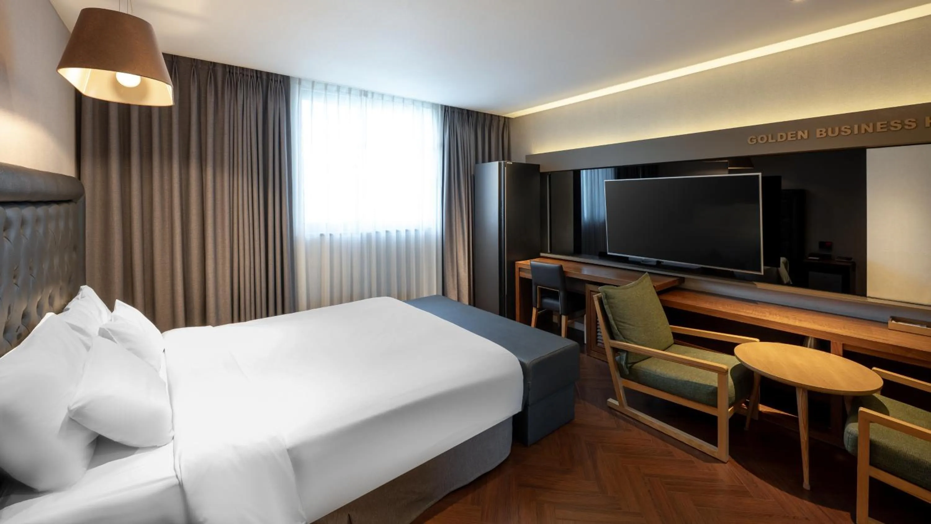 Bed in Golden Business Hotel