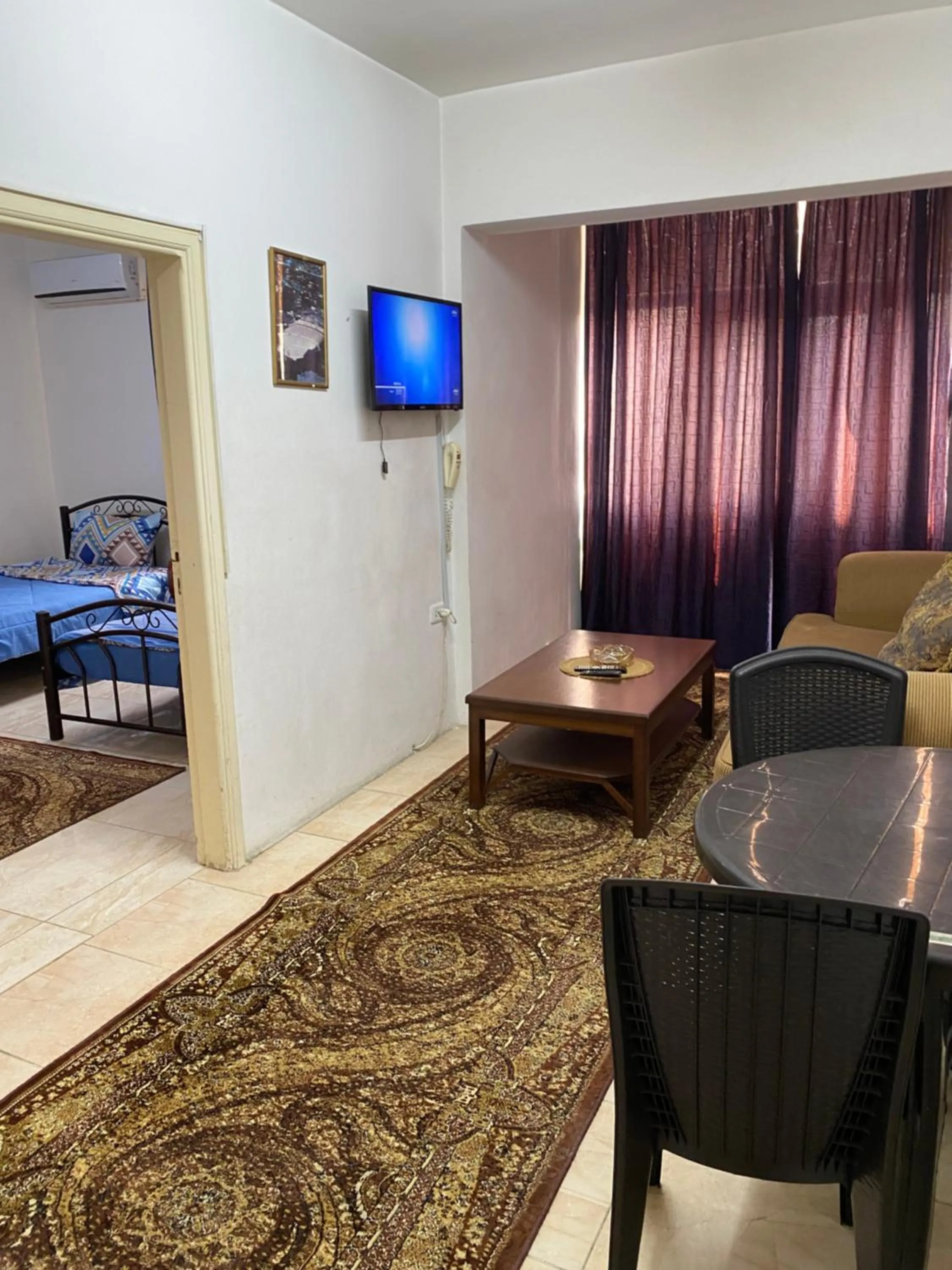 Living room, Bed in Sami Apartments