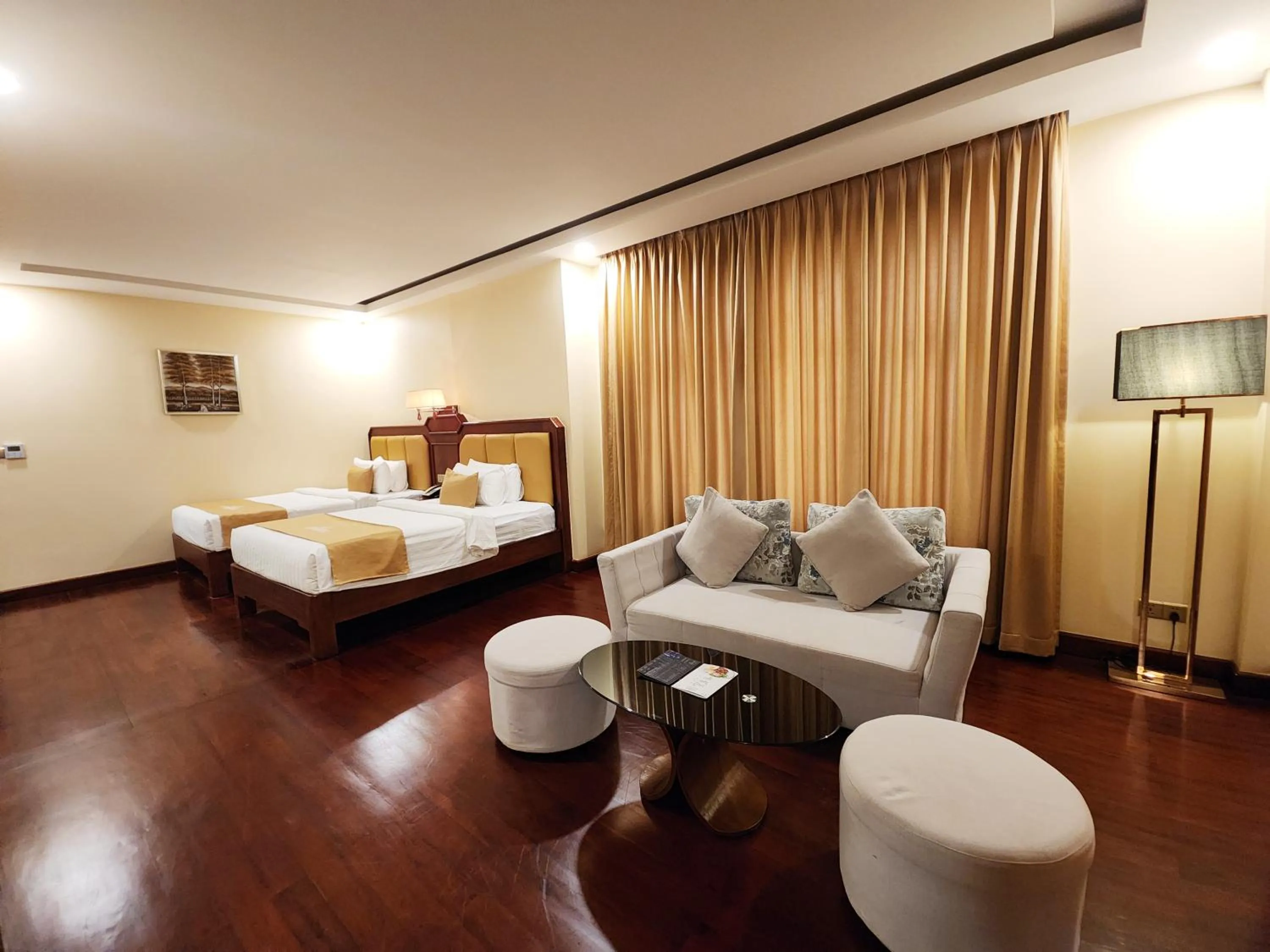Seating area, Bed in Lbn Asian Hotel