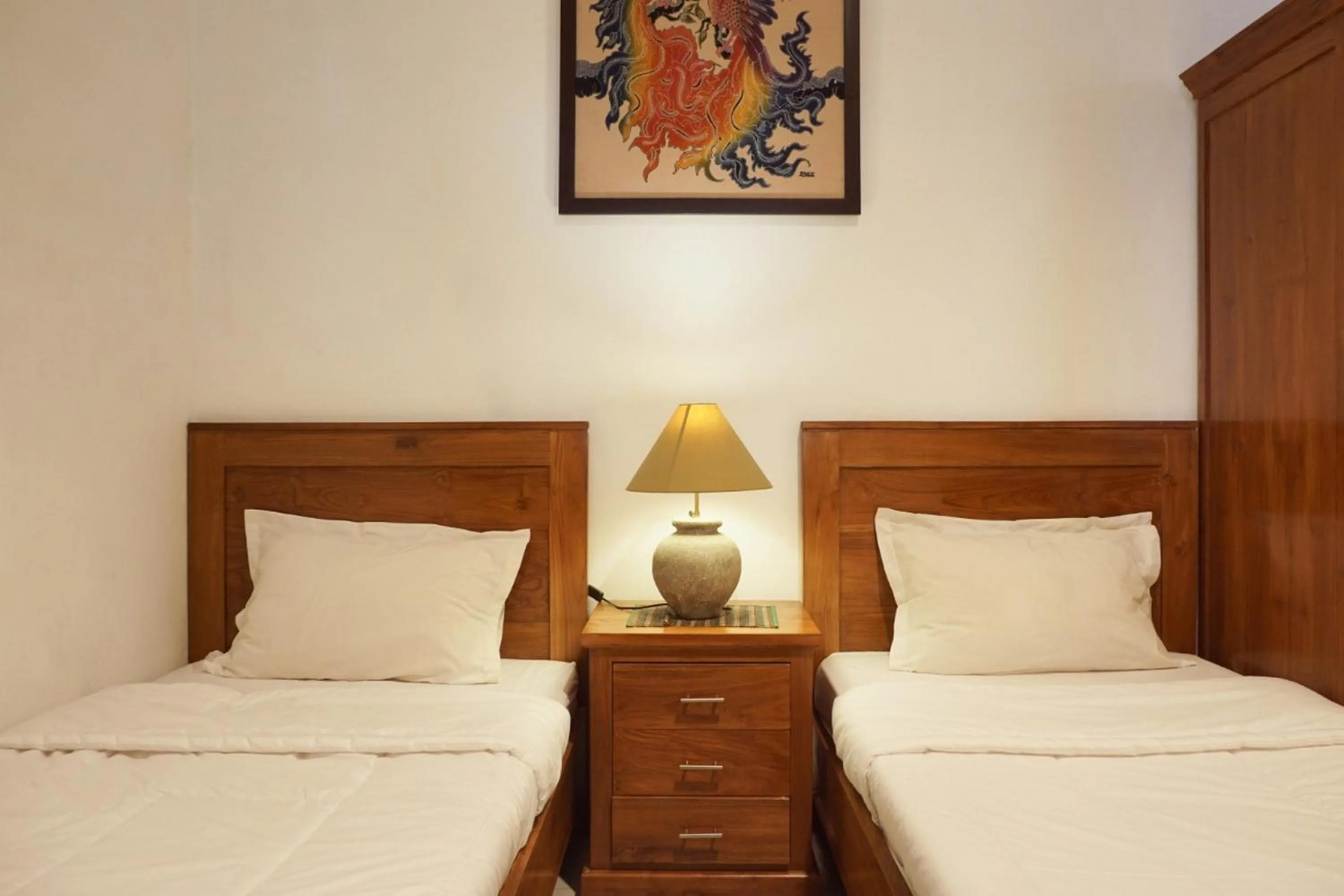 Bed in RedDoorz at Griya Cemara Homestay Yogyakarta