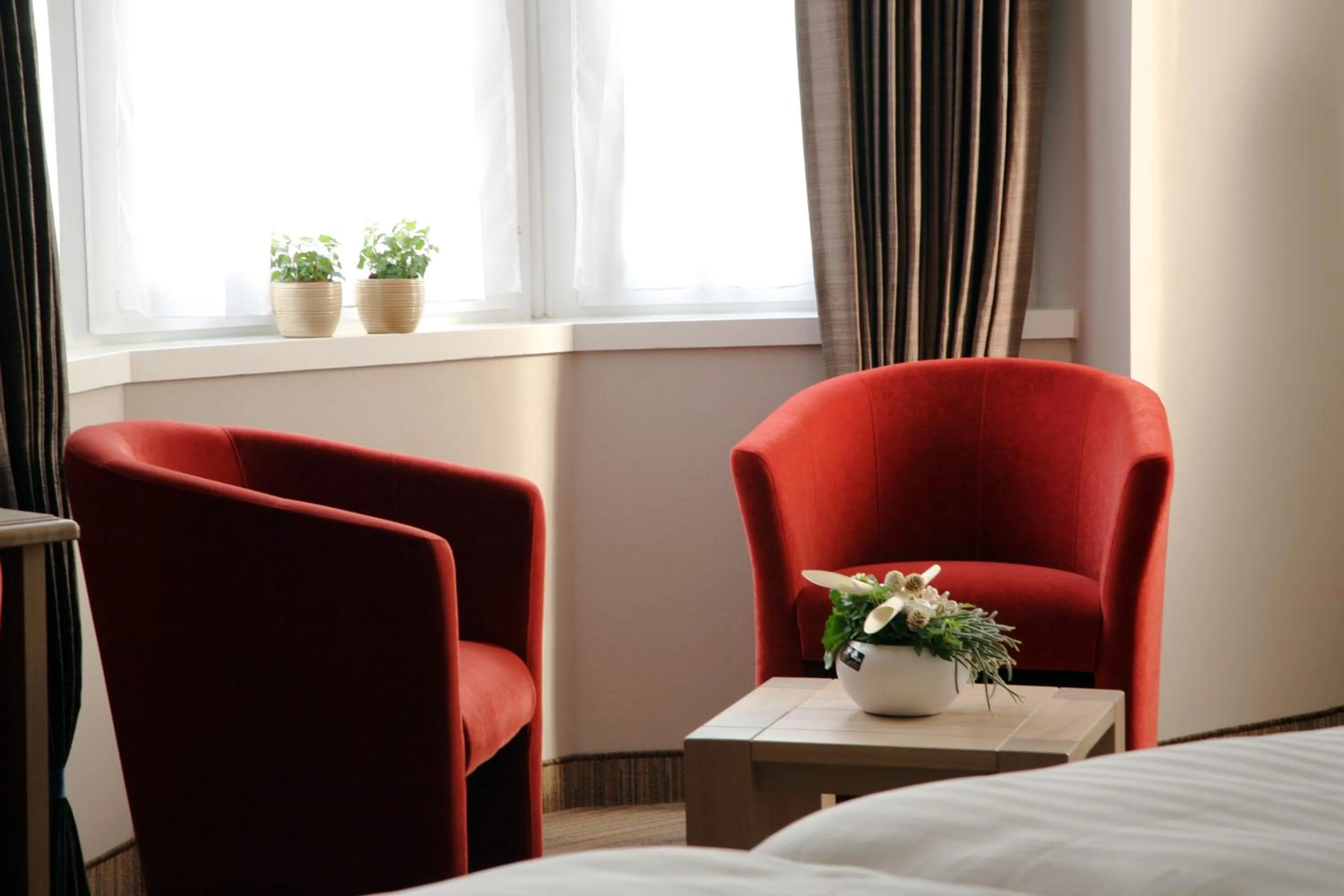 Seating area, Bed in Ambassador Hotel