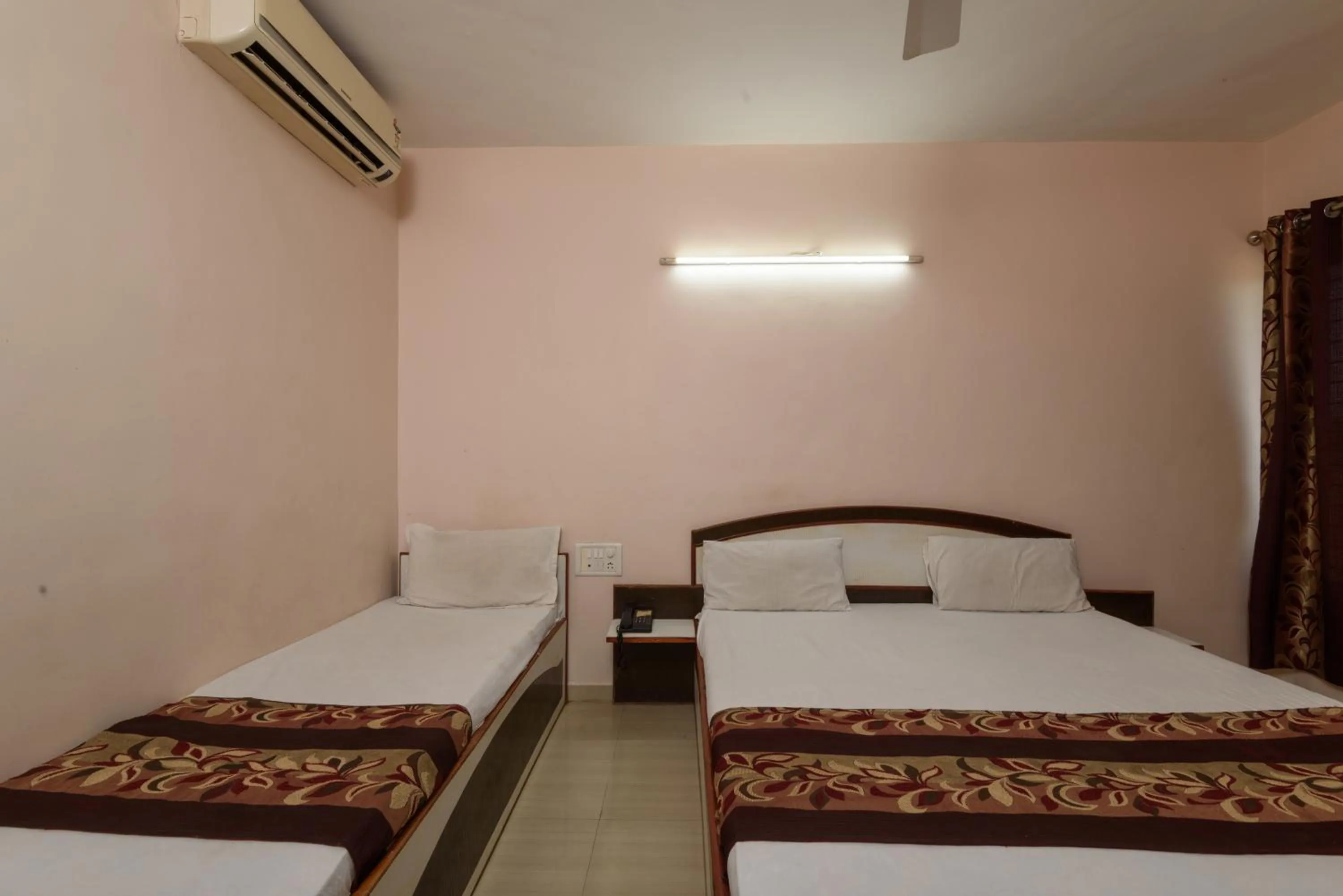 Bed in Hotel Sai Shraddha