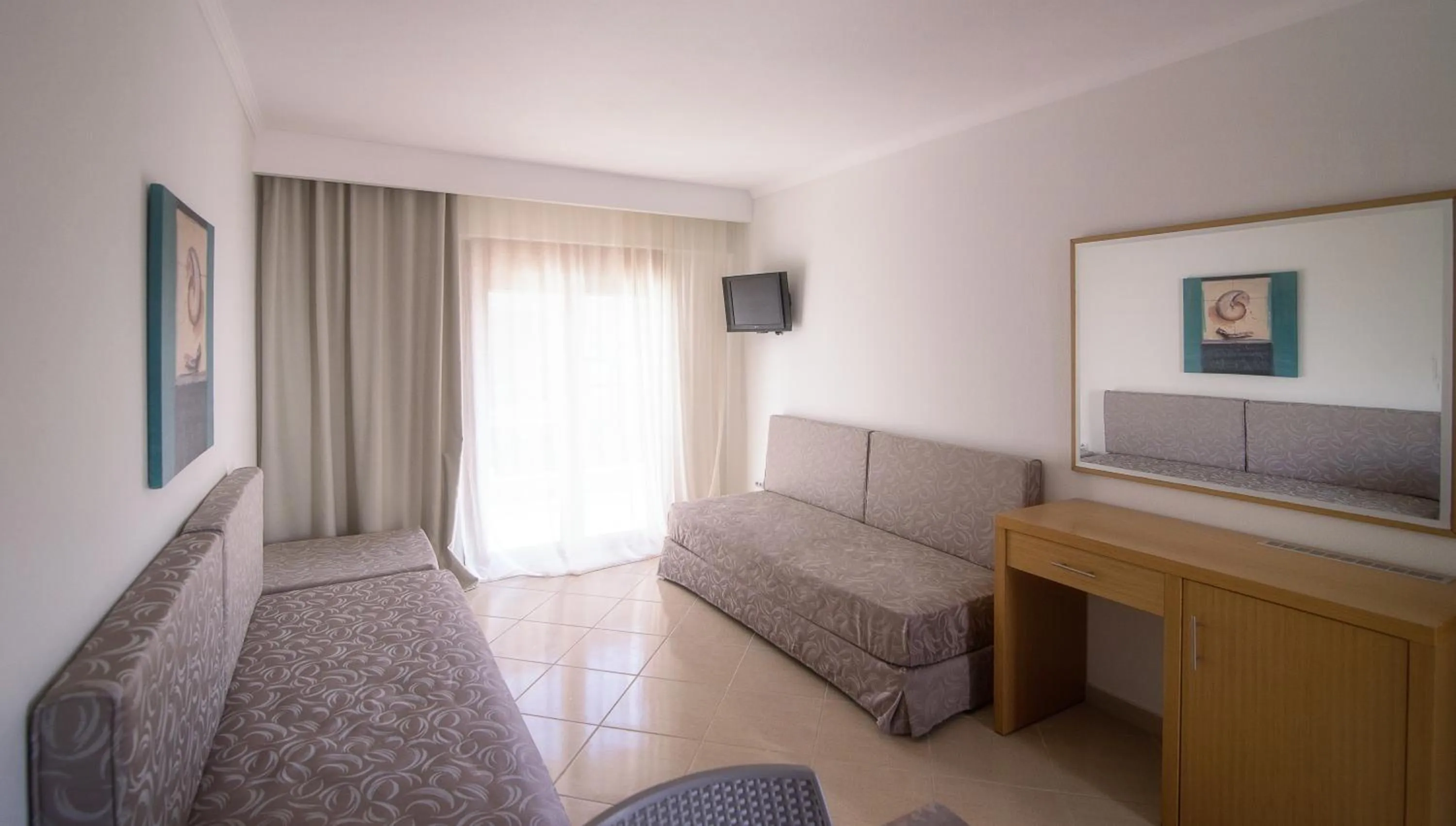 Living room in Apanemia by Flegra Hotels