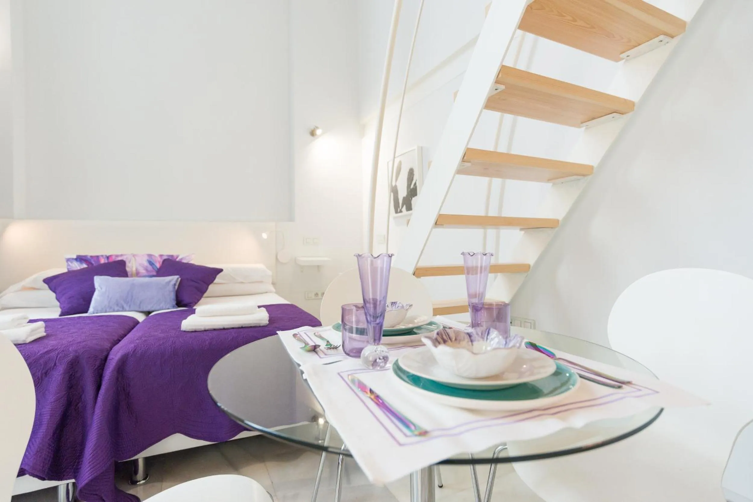 Dining area, Bed in Malaga City Breaks