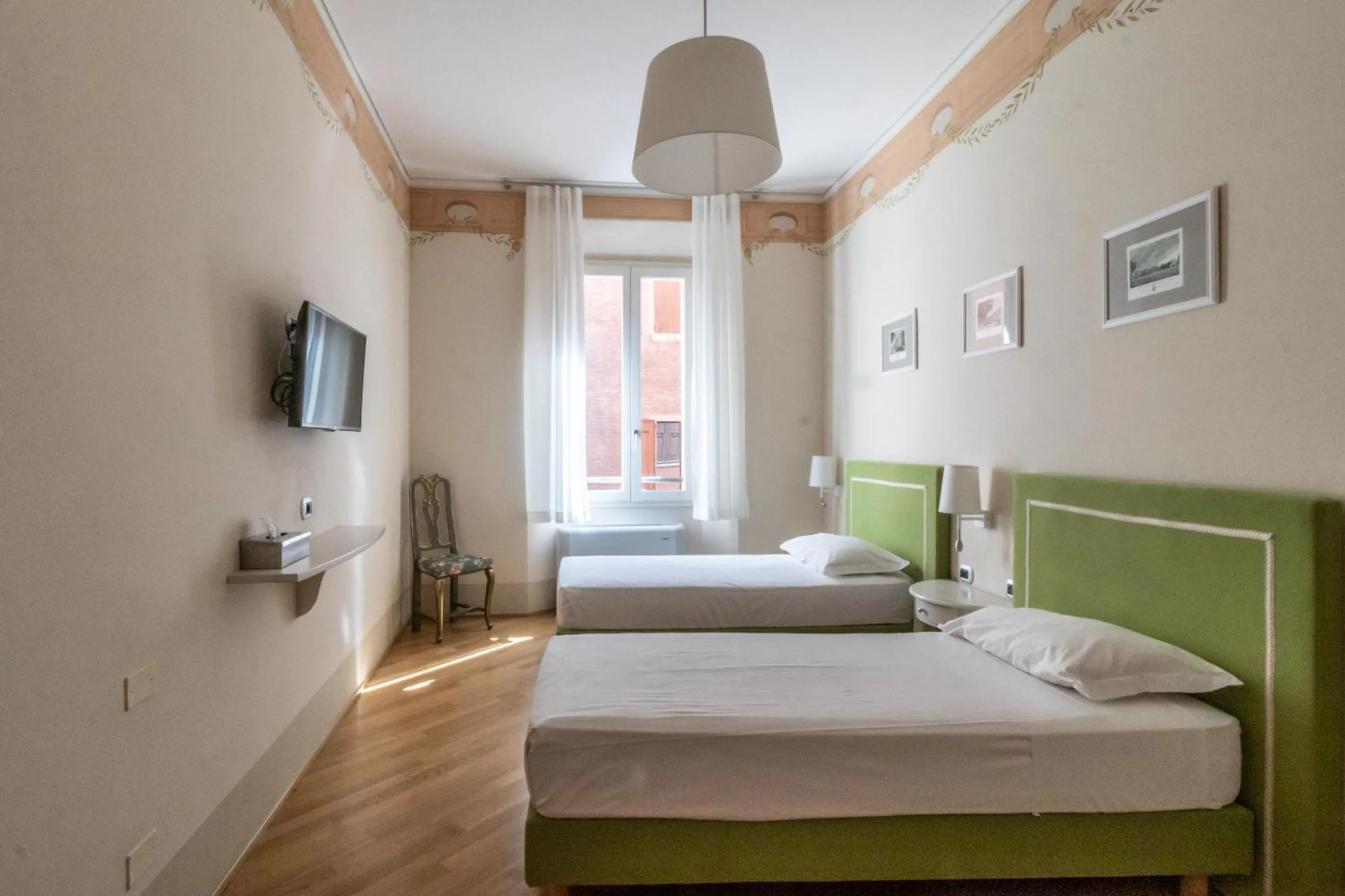 Bed in Casa Isolani Luxury Rooms Piazza Maggiore 1